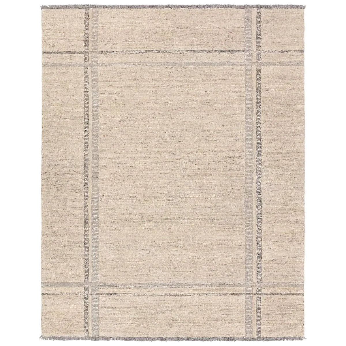 Featuring Hadi Bilal Rug by Jaipur Living at Amethyst Home. The hand-tufted Hadi Bilal introduces fresh looks inspired by modern Moroccan patterns and neutral colorways. The Bilal design features a trellis with geometric detailing, encompassing North African styles in cream and gray hues. Short, gray fringe and 100% wool pile adds to the global appeal.. Amethyst Home provides interior design, new home construction design consulting, vintage area rugs, and lighting in the Salt Lake City metro area.