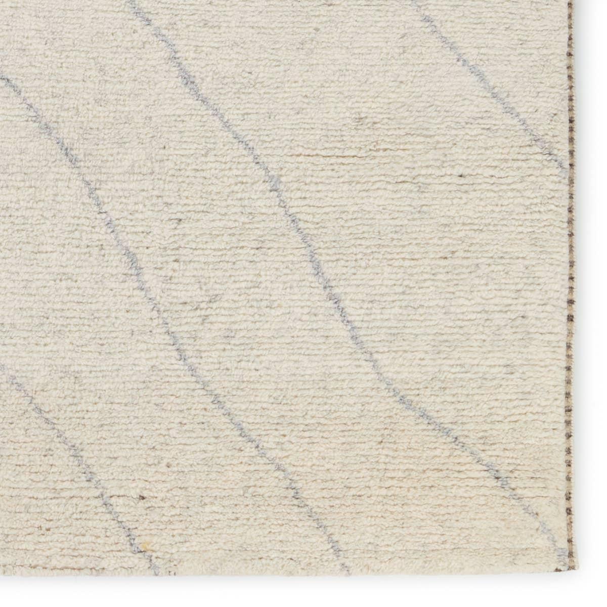 Featuring Indira Laverna Hand-Knotted Rug by Jaipur Living at Amethyst Home. Rich in detail and plush underfoot, the Indira Laverna is made up of neutral-toned modern Moroccan styles. The Laverna area rug features a slight sheen and luxurious hand-knotted construction of natural wool and viscose. A light trellis design provides geometric interest in a silve. Amethyst Home provides interior design, new home construction design consulting, vintage area rugs, and lighting in the Nashville metro area.