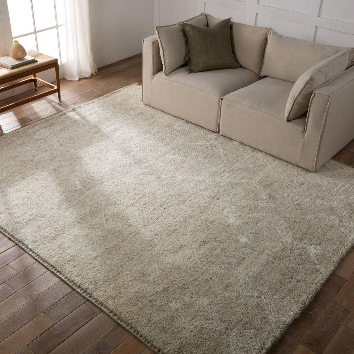 Featuring Indira Merida Hand-Knotted Rug by Jaipur Living at Amethyst Home. Rich in detail and plush underfoot, the Indira Merida is made up of neutral-toned modern Moroccan styles. The Merida area rug features a slight sheen and luxurious hand-knotted construction of natural wool and viscose. A distressed trellis design provides geometric interest in an i. Amethyst Home provides interior design, new home construction design consulting, vintage area rugs, and lighting in the Alpharetta metro area.