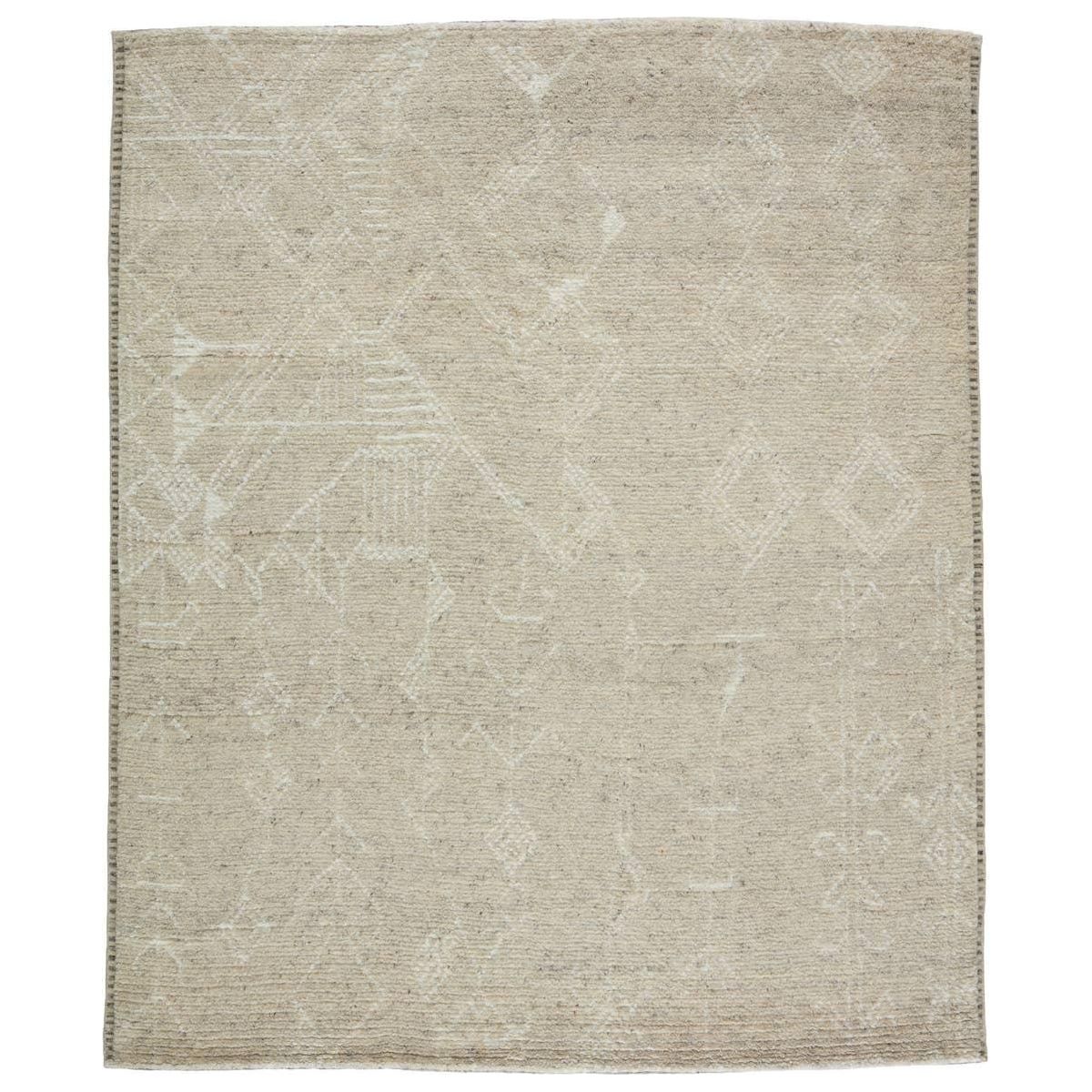 Featuring Indira Merida Hand-Knotted Rug by Jaipur Living at Amethyst Home. Rich in detail and plush underfoot, the Indira Merida is made up of neutral-toned modern Moroccan styles. The Merida area rug features a slight sheen and luxurious hand-knotted construction of natural wool and viscose. A distressed trellis design provides geometric interest in an ivory. Amethyst Home provides interior design, new home construction design consulting, vintage area rugs, and lighting in the Boston metro area.