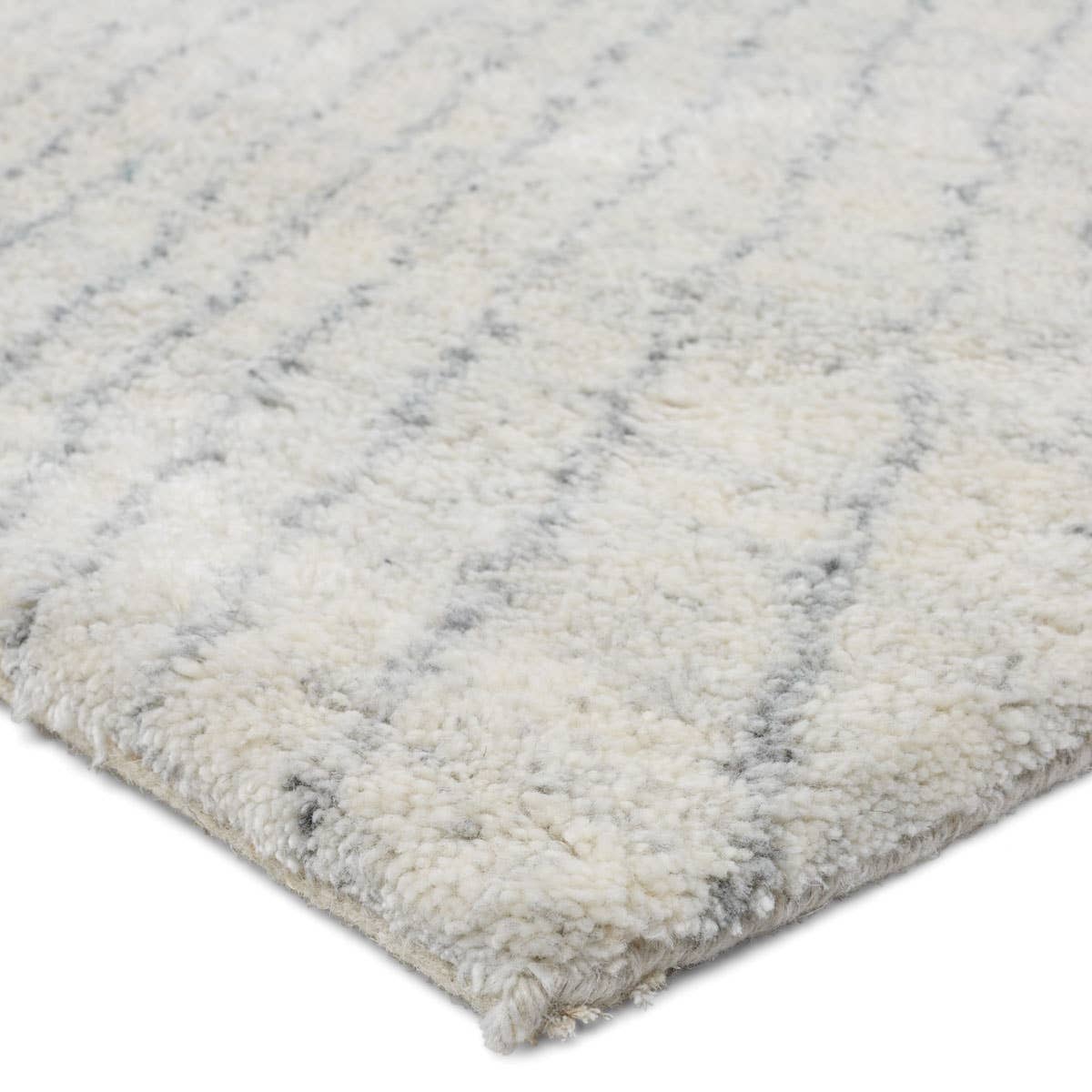 Featuring Indira Zivian Hand-Knotted Rug by Jaipur Living at Amethyst Home. Rich in detail and plush underfoot, the Indira Zivian is made up of neutral-toned modern Moroccan styles. The Zivian area rug features a slight sheen and luxurious hand-knotted construction of natural wool and viscose. A soft linear design provides geometric interest in an light blue h. Amethyst Home provides interior design, new home construction design consulting, vintage area rugs, and lighting in the Dallas metro area.