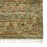 Featuring Jinsen Augusta Hand-Knotted Rug by Jaipur Living at Amethyst Home. The hand-knotted Jinsen Augusta features a fresh incarnation of the vintage Turkish textile look. Classic in pattern and modern in color, the Augusta rug boasts a beautiful palette of green, burnished gold, and hints of taupe featuring distinct dye-lot details and subtle fringe. Th. Amethyst Home provides interior design, new home construction design consulting, vintage area rugs, and lighting in the Charlotte metro area.