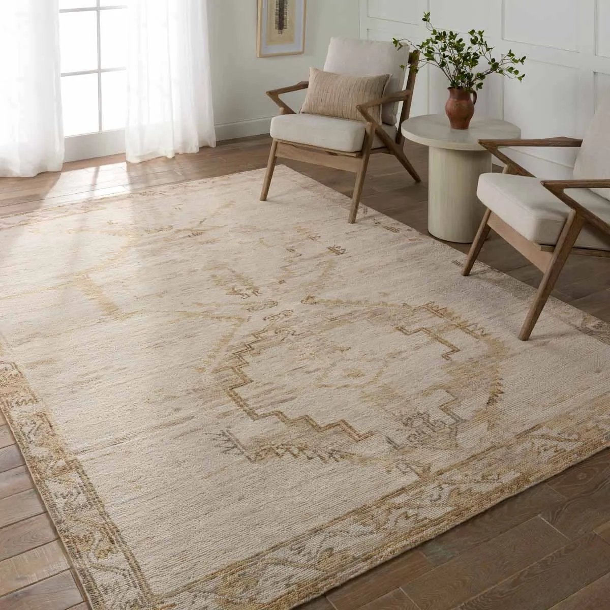 Featuring Jinsen Alamo Rug by Jaipur Living at Amethyst Home. The hand-knotted Jinsen collection features a fresh incarnation of the vintage Turkish textile look. Classic in pattern and modern in color, the Alamo rug boasts a beautiful palette of cream, beige, gold, and brown, featuring distinct dye-lot details and subtle fringe. This artisan-crafted medall. Amethyst Home provides interior design, new home construction design consulting, vintage area rugs, and lighting in the Nashville metro area.