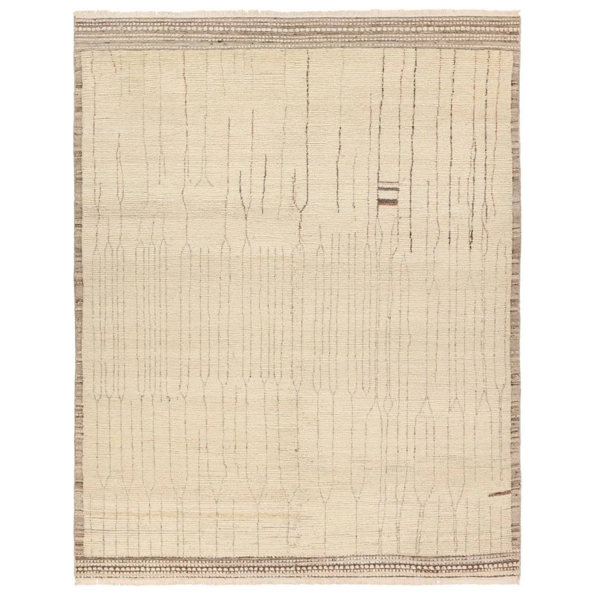 Featuring Kazben Atalaya Hand-Knotted Rug by Jaipur Living at Amethyst Home. Full of texture, the handknotted Kazben Atalaya stuns with modern Moroccan patterns in natural hues. The Atalaya design delights with a gray and brown abstract-linear pattern on a cream base. A dotted border adds the finishing touches to this elevated accent piece. Low, ribbed pile. Amethyst Home provides interior design, new home construction design consulting, vintage area rugs, and lighting in the San Diego metro area.