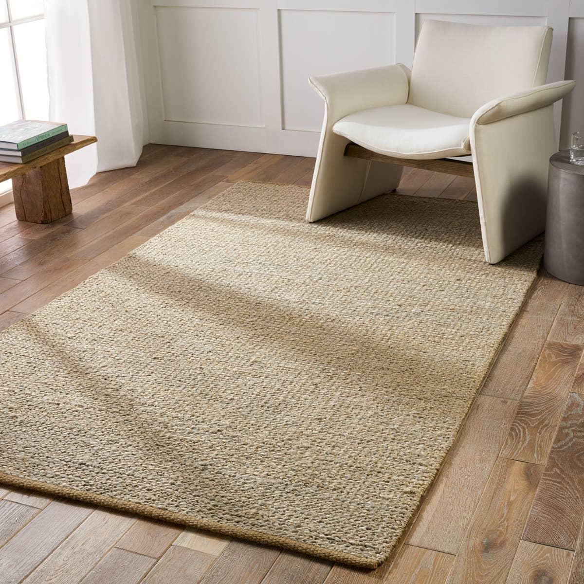 Featuring Laylani Murrel Rug by Jaipur Living at Amethyst Home. Simple and serene, the Laylani Murrel features handwoven natural fiber designs with tonal variation through the solid, chunky weave. The Murrel rug features a 100% jute make in an organic golden-brown colorway. A tightly woven border creates a beautiful finishing touch on this global accent piece. Amethyst Home provides interior design, new home construction design consulting, vintage area rugs, and lighting in the Houston metro area.