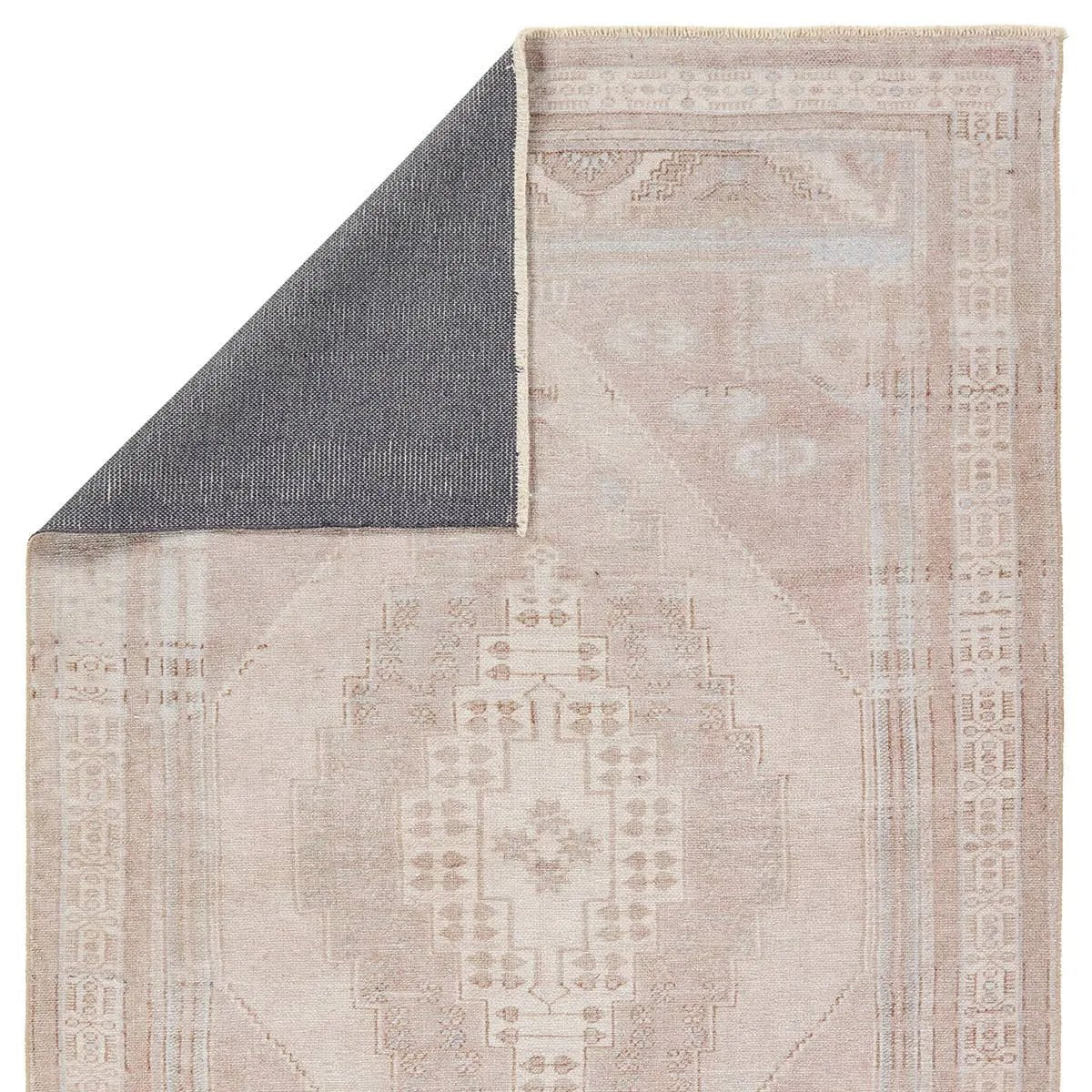 Featuring Lumal Orame Rug by Jaipur Living at Amethyst Home. Distressed, vintage designs offer an elevated tone for the Lumal Collection. The Orame rug features a Southwestern-inspired medallion, geometric border, and intricate detailing in tones of mauve, light blue, brown, and cream. This machine washable rug is stain resistant and easy to clean, perfect fo. Amethyst Home provides interior design, new home construction design consulting, vintage area rugs, and lighting in the Seattle metro area.