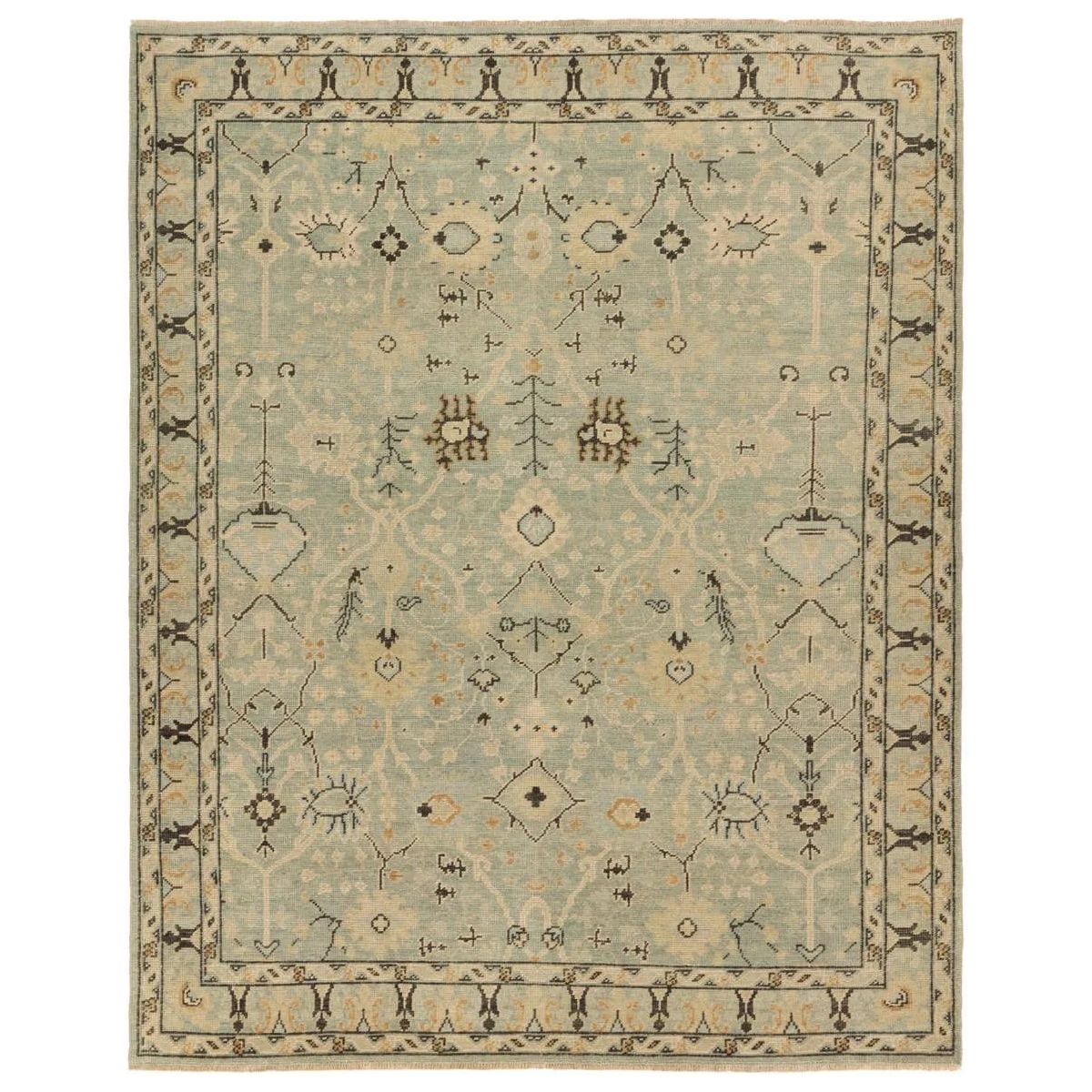 Featuring Rhapsody Markid Hand-Knotted Rug by Jaipur Living at Amethyst Home. The Rhapsody Markid features heirloom-quality designs of stunningly abrashed Old World patterns. The Markid area rug boasts a beautifully distressed floral and Oushak motif with a decorative border. The light blue and tan tones are accented with black and beige hues for added dep. Amethyst Home provides interior design, new home construction design consulting, vintage area rugs, and lighting in the Des Moines metro area.