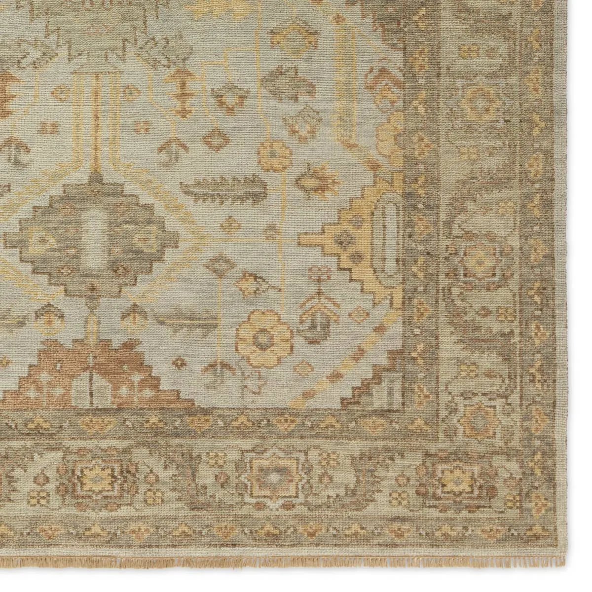 Featuring Rhapsody Gehenna Hand-Knotted Rug by Jaipur Living at Amethyst Home. The Rhapsody Gehenna features heirloom-quality designs of stunningly abrashed Old World patterns. The Gehenna area rug boasts a beautifully distressed medallion motif with a decorative border and floral detailing. The gray and brown tones are accented with light blue, sage, bei. Amethyst Home provides interior design, new home construction design consulting, vintage area rugs, and lighting in the Los Angeles metro area.