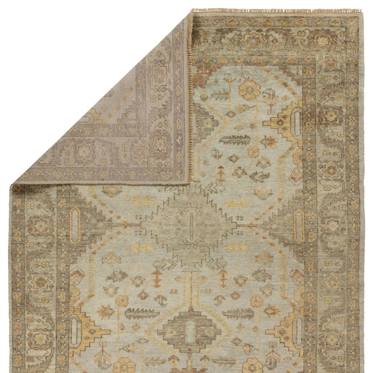 Featuring Rhapsody Gehenna Hand-Knotted Rug by Jaipur Living at Amethyst Home. The Rhapsody Gehenna features heirloom-quality designs of stunningly abrashed Old World patterns. The Gehenna area rug boasts a beautifully distressed medallion motif with a decorative border and floral detailing. The gray and brown tones are accented with light blue, sage, beig. Amethyst Home provides interior design, new home construction design consulting, vintage area rugs, and lighting in the Washington metro area.