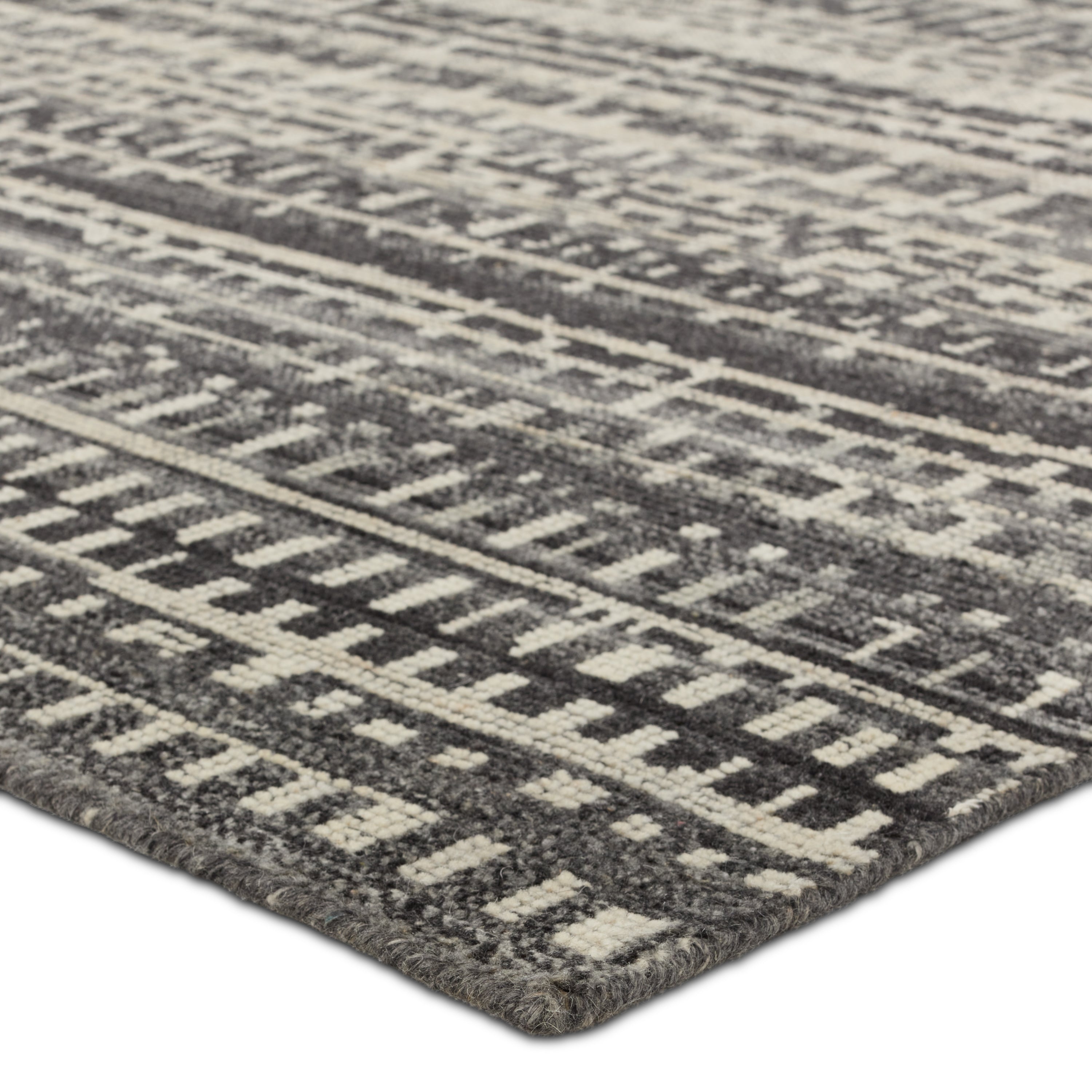 Featuring Rize Jamaal Hand-Knotted Rug by Jaipur Living at Amethyst Home. The Rize collection offers intricate and delicately designed global patterns to the modern home. The luxurious Jamaal area rug showcases a striped, linear motif in a classic gray, cream, and black colorway. This accent's hand-knotted wool construction ensures timeless durability and a stunning presence in bohe. Amethyst Home provides interior design, new construction, custom furniture, and area rugs in the Dallas metro area.