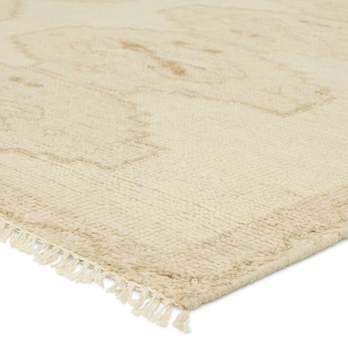 Featuring Sevak Ismail Hand-Knotted Rug by Jaipur Living at Amethyst Home. The hand-knotted Sevak Ismail emulates vintage rugs with traditional Turkish patterns, distressing, and a neutral color palette for versatility. The Ismail design features mini-medallions and a subtle border in tones of tan, cream, and brown. The fringe adds a global charm that delig. Amethyst Home provides interior design, new home construction design consulting, vintage area rugs, and lighting in the Charlotte metro area.