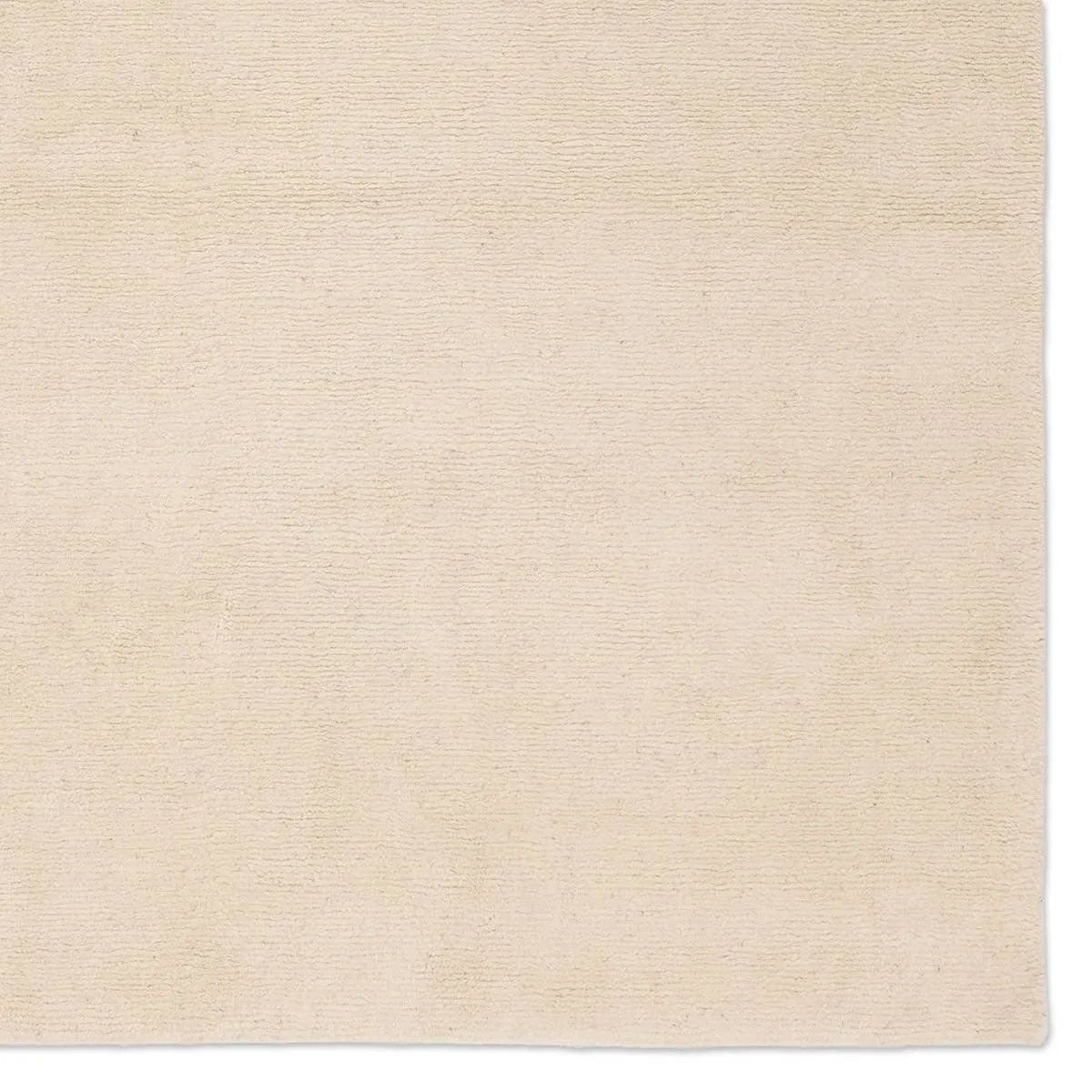 Featuring Si Blanc Theia Hand-Knotted Rug by Jaipur Living at Amethyst Home. Made from the exceptional soft fleece and durability of Alpaca and New Zealand Wool, the Si Blanc Theia creates uniform excellence as the understated centerpiece of a room. With its natural luster and timeless charm the Theia design made of cream Tibetan hand knots brings simple an. Amethyst Home provides interior design, new home construction design consulting, vintage area rugs, and lighting in the Charlotte metro area.