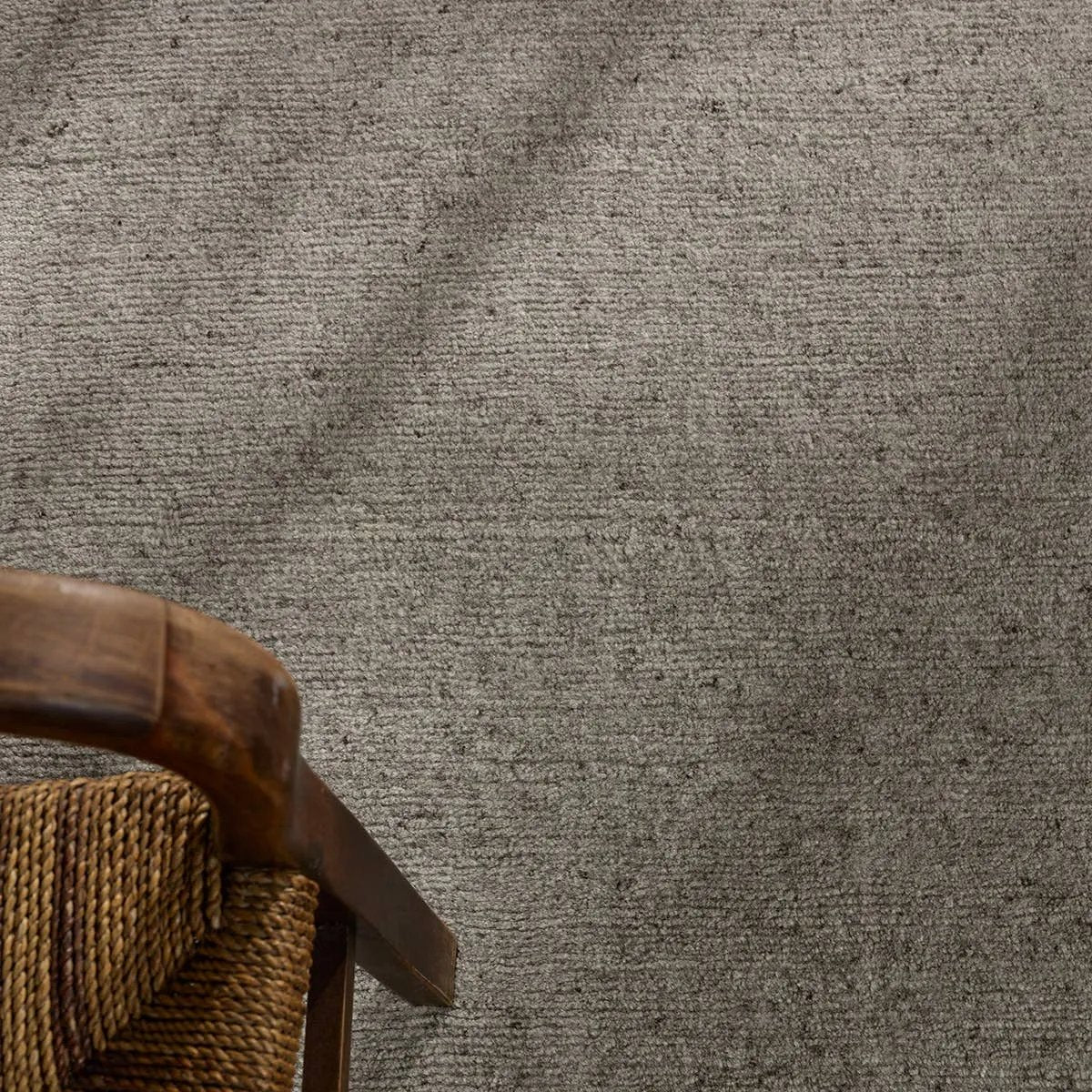 Featuring Si Blanc Theia Hand-Knotted Rug by Jaipur Living at Amethyst Home. The Si Blanc Collection seamlessly blends the sumptuous fleece of Alpaca and the resilience of New Zealand Wool, creating a harmonious symphony of softness and durability. The Theia design is crafted with precision using gray Tibetan hand knots, embodying simplicity and soft sophistic. Amethyst Home provides interior design, new home construction design consulting, vintage area rugs, and lighting in the Dallas metro area.