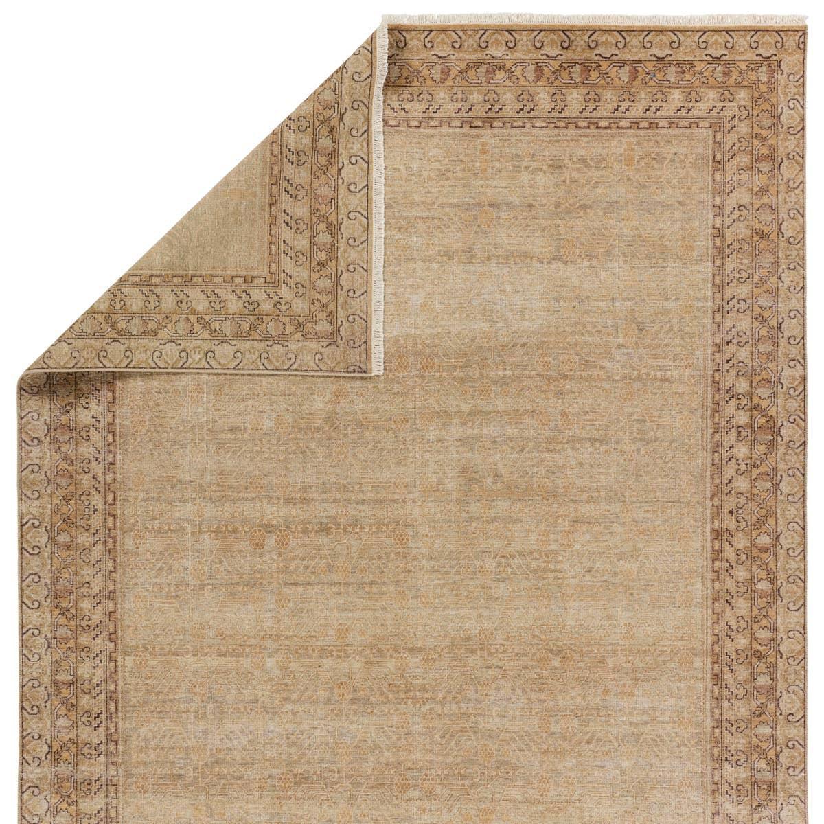 Featuring Serenity Hand-Knotted Rug by Jaipur Living at Amethyst Home. Whimsical colorways combine with the opulent detail of a traditional-inspired pattern?the Serenity represents nostalgia and progression, heritage and the contemporary. The Serenity rug features a heavily distressed trellis and intricate border design with a gold, brown, and beige colorway. Amethyst Home provides interior design, new home construction design consulting, vintage area rugs, and lighting in the Monterey metro area.