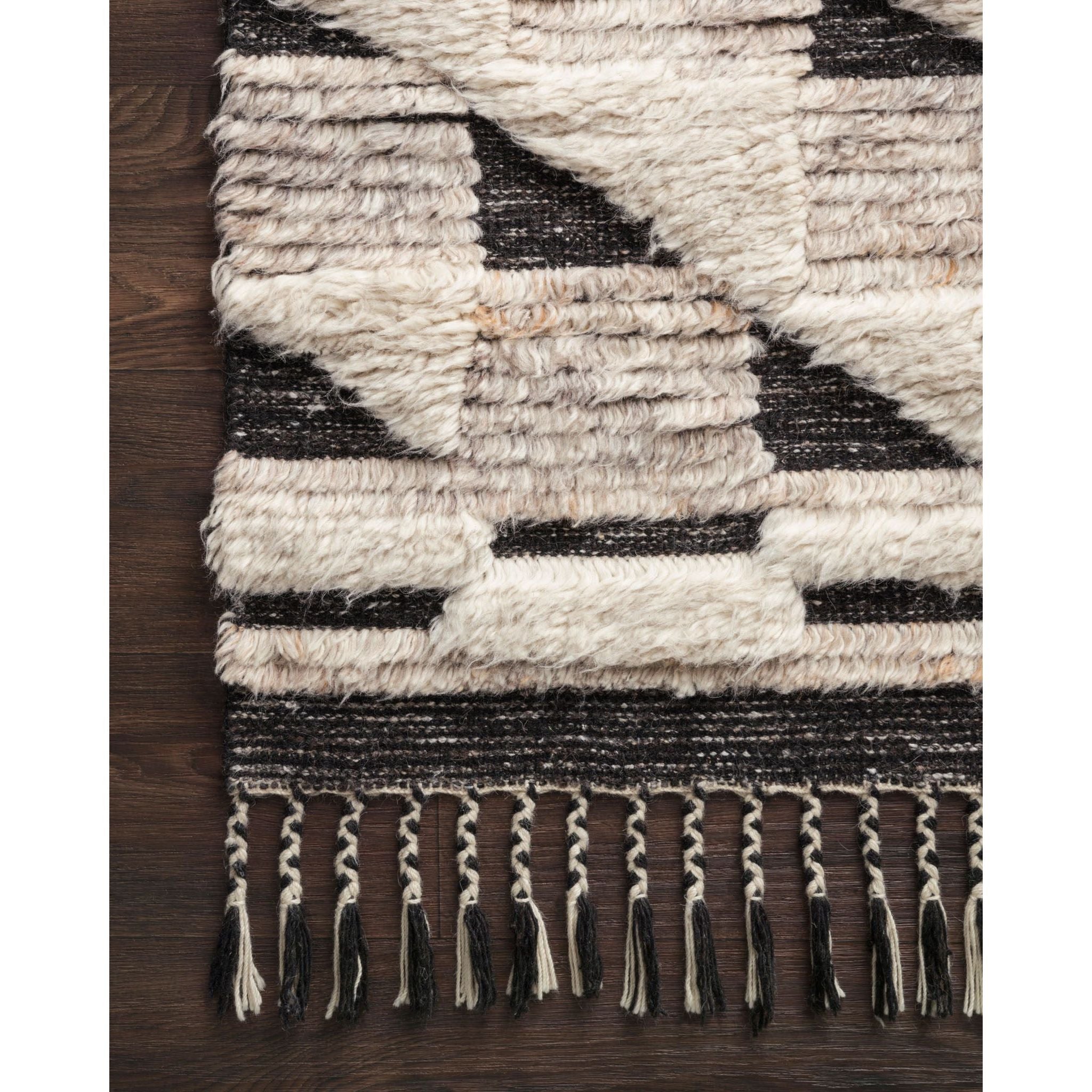 Featuring Khalid Natural/Black Hand-Knotted Rug by Loloi at Amethyst Home. A nod to timeless Moroccan style, the Khalid Collection is hand-knotted in India by skilled artisans. The soft pile features 100% natural, undyed wool, lending slight variations in tones that make each piece it's own. Plus, each rug is finished with a thoughtfully designed fringe.
Hand .  Amethyst Home provides interior design, new home construction design consulting, vintage area rugs, and lighting in the Tampa metro area.
