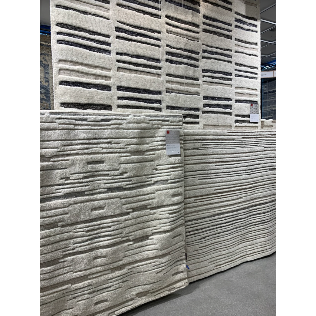 Featuring Bennett Ivory / Charcoal Hand-Knotted Rug by Loloi at Amethyst Home. Dimensional yet soft, the Bennett Ivory / Charcoal Area Rug is hand-knotted of wool, viscose and polyester in India. Featuring a new carve like high-low pile, Bennett has an ivory base with abstract tonal designs. Plus, it's plush underfoot -- a great choice for your office, bedroo.  Amethyst Home provides interior design, new home construction design consulting, vintage area rugs, and lighting in the Austin metro area.