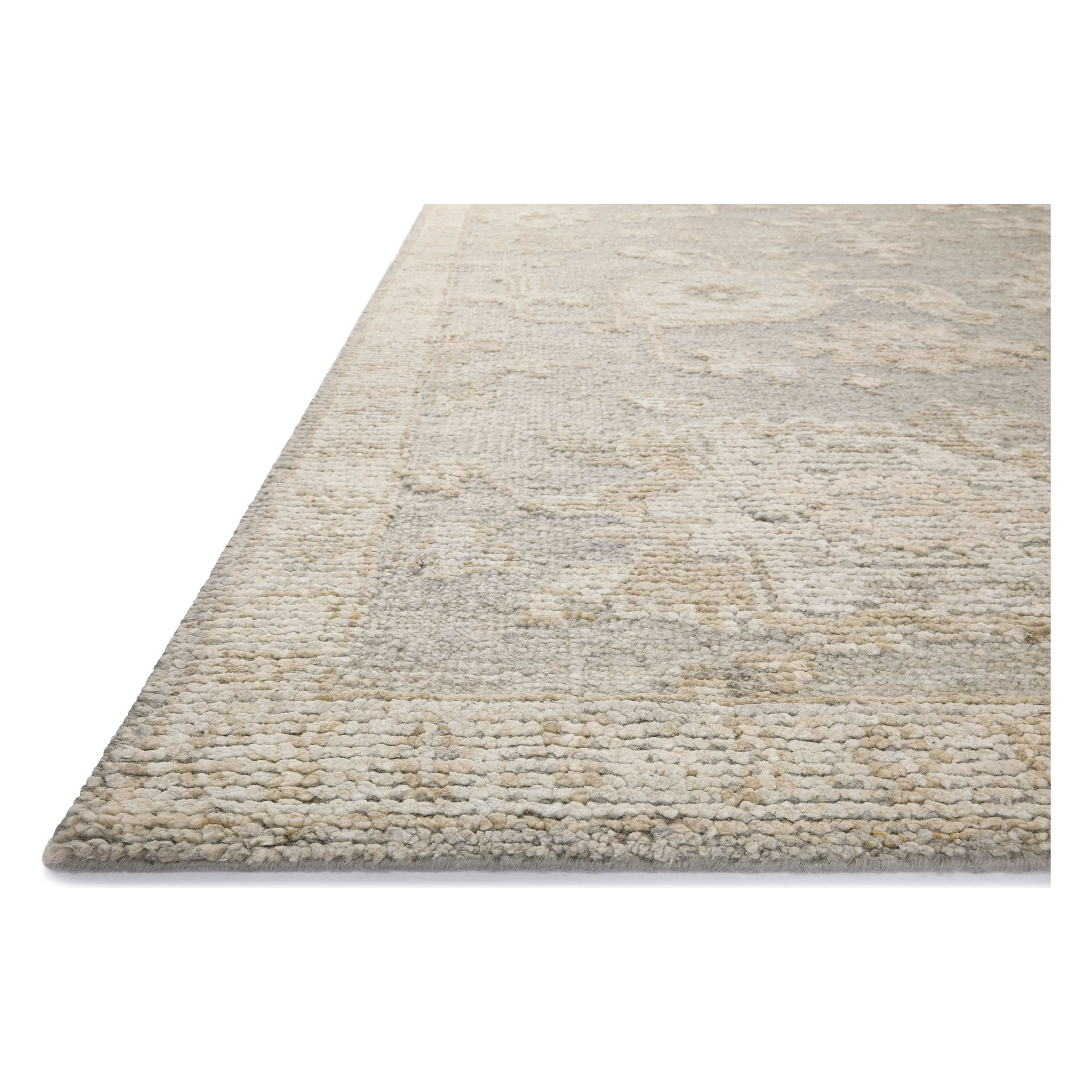 Featuring Adelaide Grey / Mist Hand-Knotted Rug by Loloi at Amethyst Home. The Adelaide Collection is a cool-toned area rug with asymmetrical motifs that float across the soft wool surface. Restrained in color and dynamic in texture, Adelaide’s variable pile height adds subtle dimension as the light changes throughout the day. Hand-knotted by artisans in Ind. Amethyst Home provides interior design, new home construction design consulting, vintage area rugs, and lighting in the Austin metro area.