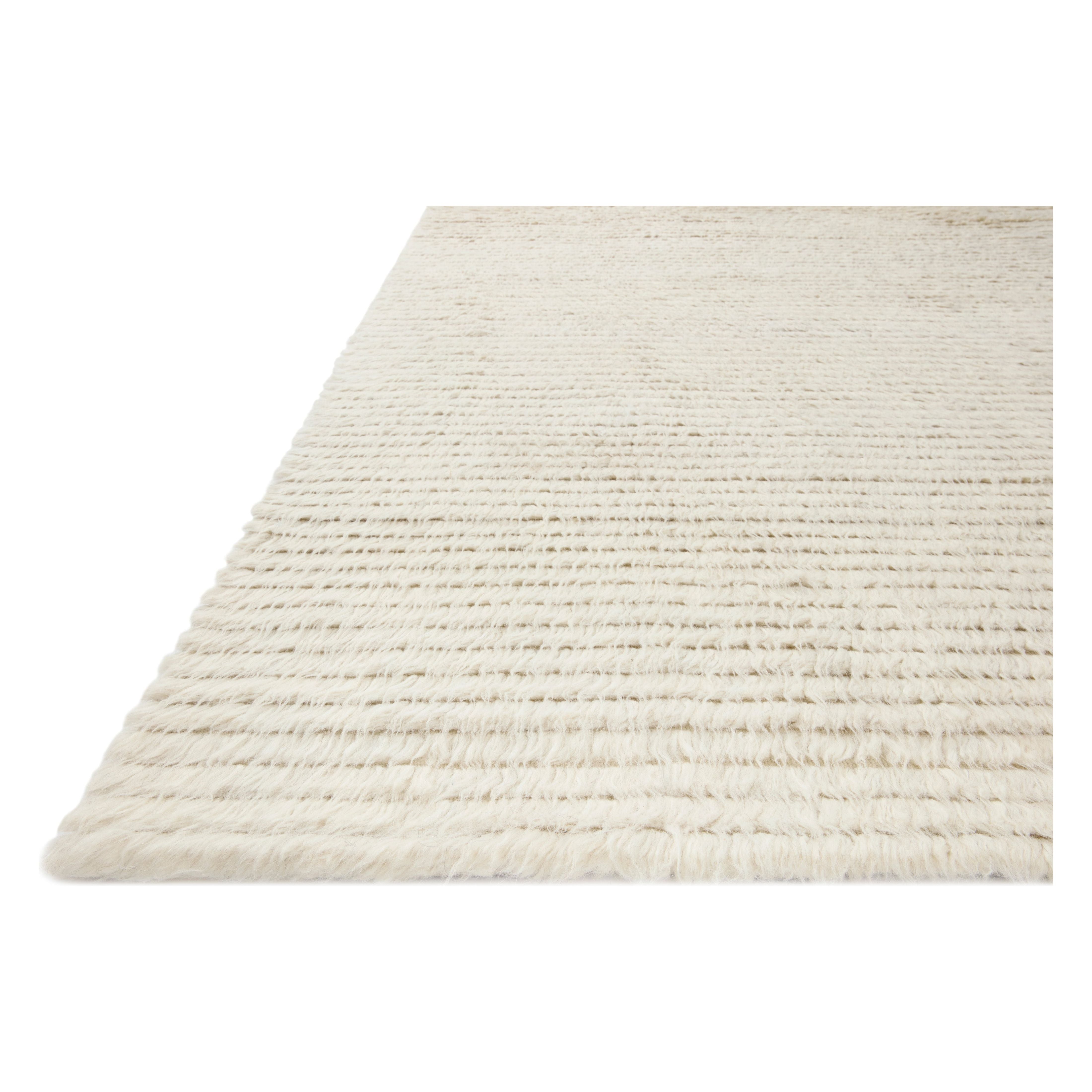 Featuring Amber Lewis x Loloi Woodland Ivory Rug by Loloi at Amethyst Home. The Amber Lewis x Loloi Woodland Ivory Rug has a lush, soft pile inspired by the tree-lined city of Woodland, California. A slightly ridged construction adds dimension and movement to this stylish, modern rug. Hand-knotted by artisans in India, the Woodland Collection is GoodWeave certified, ensuring our commitment. Amethyst Home provides interior design services, furniture, rugs, and lighting in the Des Moines metro area.