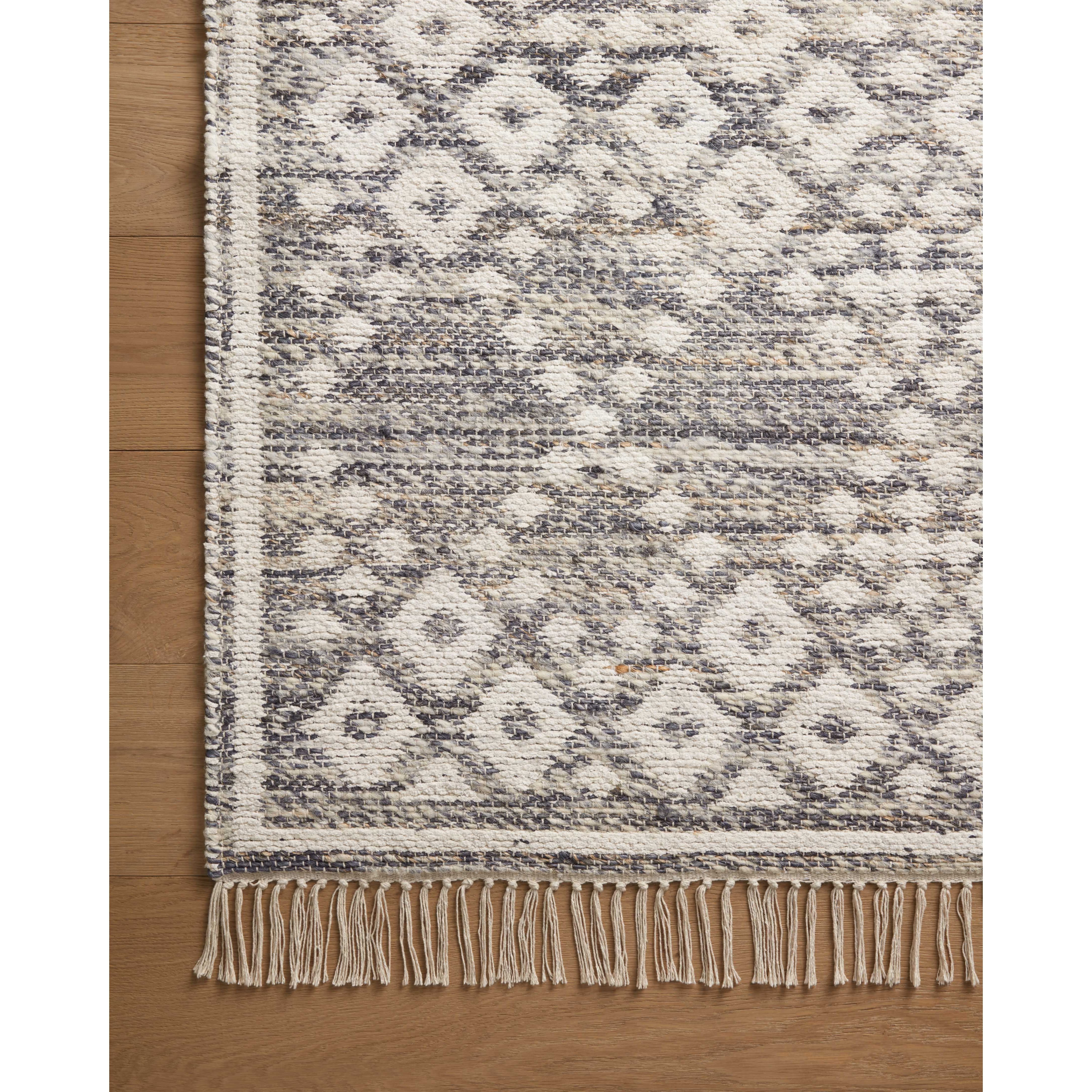 Featuring Angela Rose x Loloi Rivers Denim / Ivory Rug by Loloi at Amethyst Home. The Rivers Denim / Ivory rug by Angela Rose x Loloi is a modern flatweave area rug with a reversible design featuring symmetrical motifs. Woven of wool, cotton, and jute, Rivers combines natural materials with an airy, natural aesthetic. The soft colors of the rug create a wat. Amethyst Home provides interior design, new home construction design consulting, vintage area rugs, and lighting in the Nashville metro area.