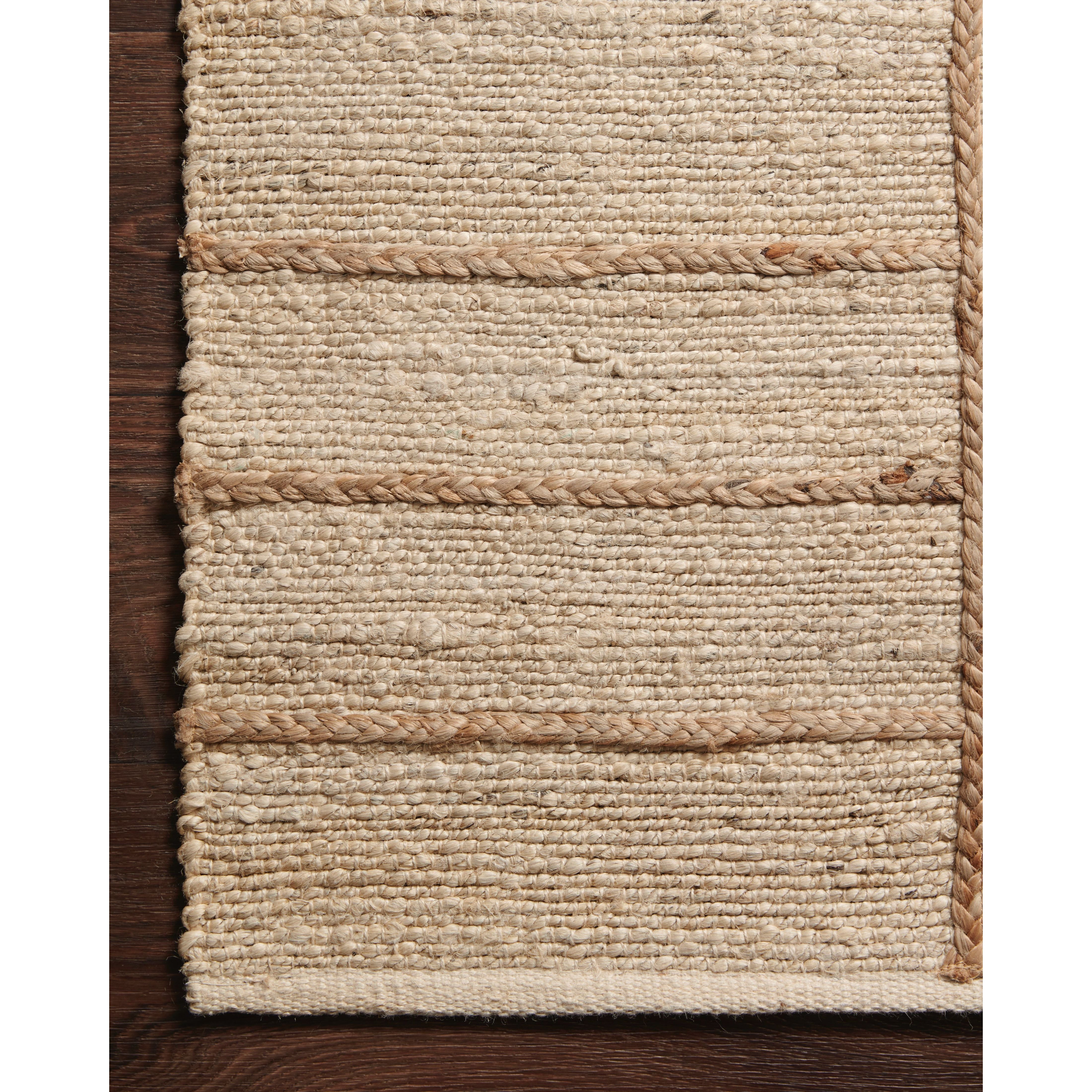 Featuring Bodhi Ivory / Natural BOD-04 Rug by Loloi at Amethyst Home. A tonal approach to Moroccan-inspired rugs, the Bodhi Ivory / Natural rug from Loloi is hand-woven of 100% jute by skilled artisans. This rug features linear and braided details, creating natural variations that make a subtle yet striking statement.
The Bodhi rug would be a great addition for an entryway, living ro. Amethyst Home provides interior design, new construction, custom furniture, and rugs for the Nashville metro area.