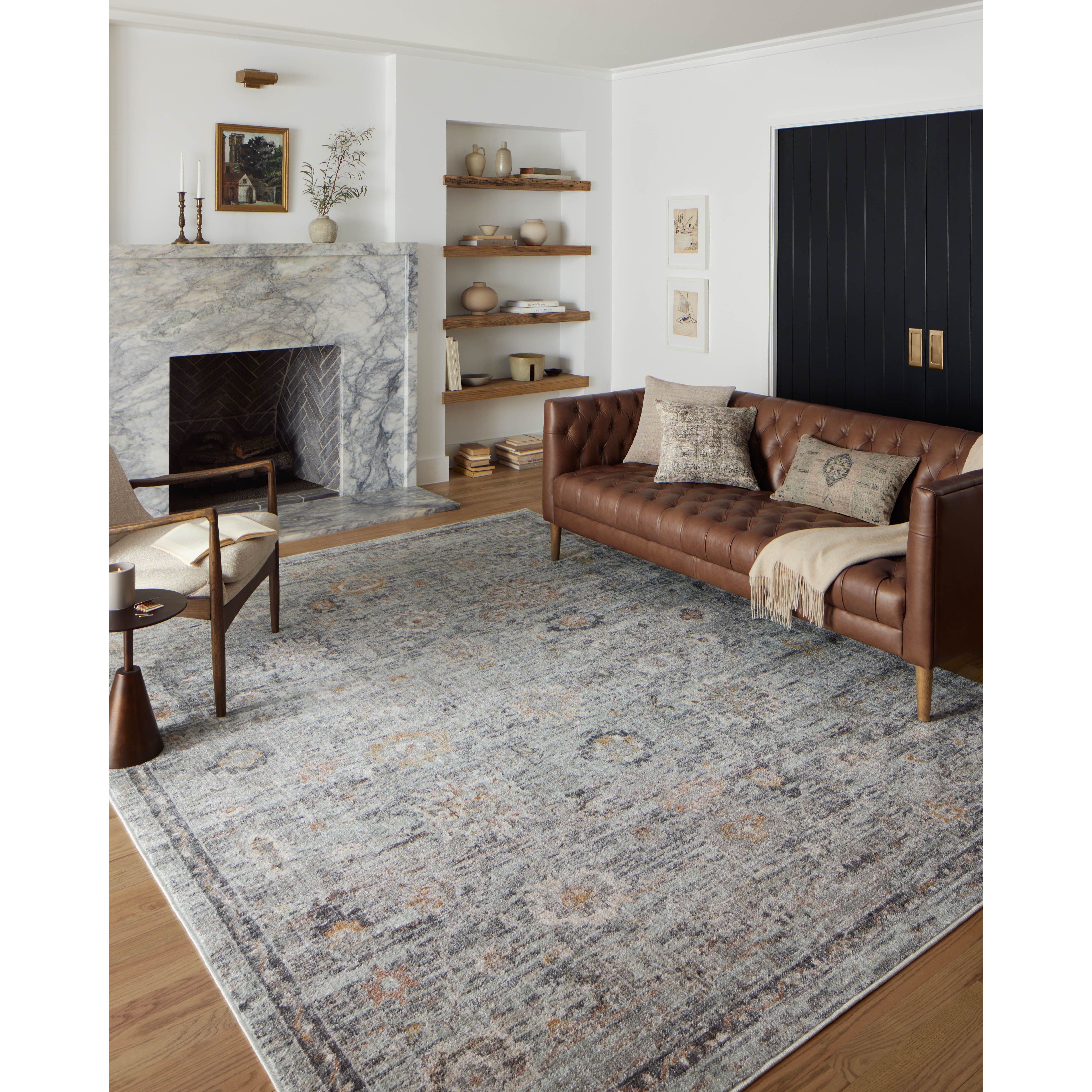 Featuring Monroe Sky / Gold Rug by Loloi at Amethyst Home. Inspired by antique Turkish Oushak carpets with large-scale motifs, the Monroe Sky / Gold Rug modernizes the traditional design in neutral palettes, many of which have black details that anchor the rug in the room. Monroe is power-loomed of 100% polypropylene for easy care and reliable durability. Mad. Amethyst Home provides interior design, new home construction design consulting, vintage area rugs, and lighting in the Houston metro area.