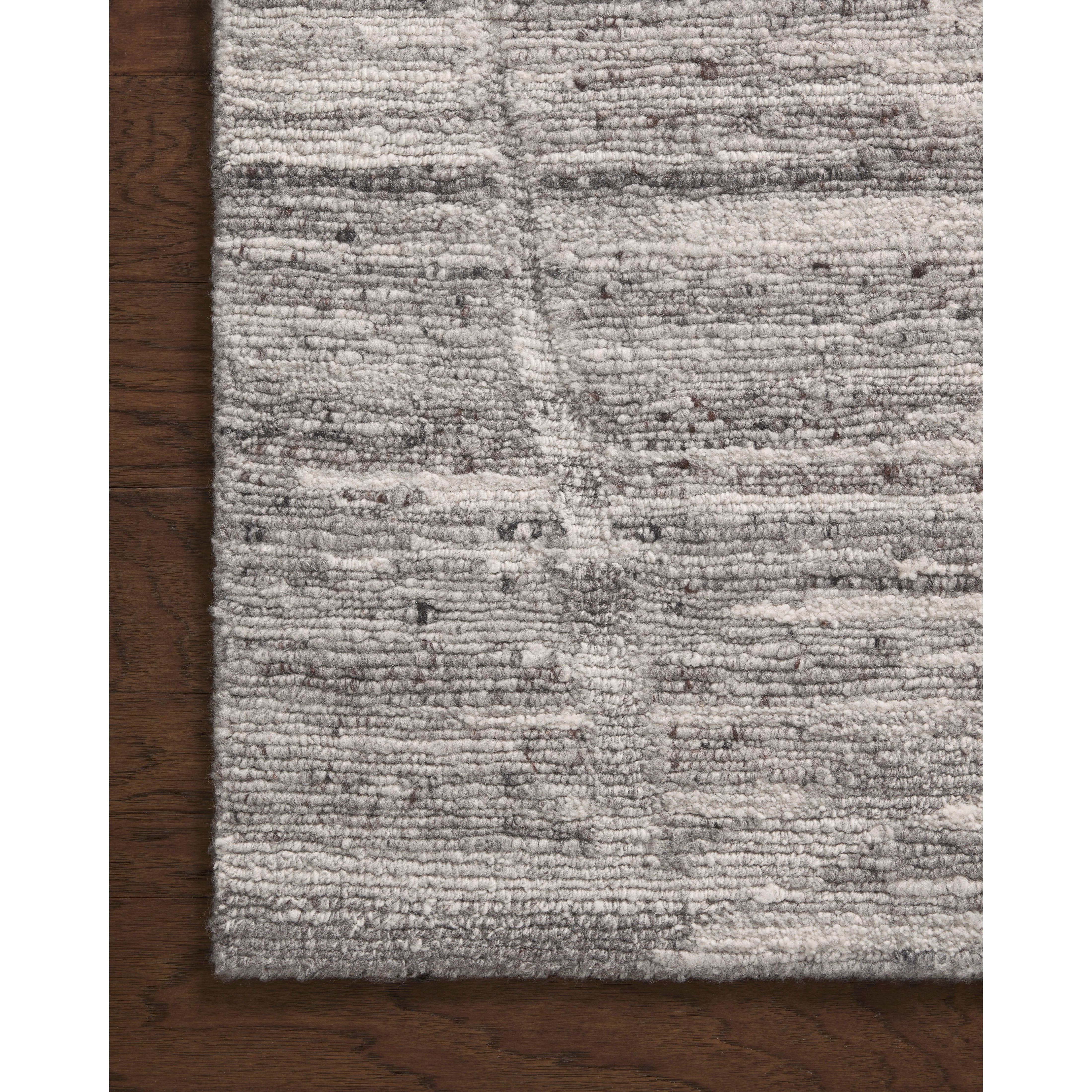Featuring Raquel Grey / Stone Rug by Loloi at Amethyst Home. The Raquel Collection exemplifies what makes a hand-knotted rug so unique. Each area rug has a ribbed texture and subtle striping created by the artisan’s cut-and-loop technique. Raquel features an organic, asymmetrical linear pattern in an airy, neutral palette. With both an elevated look and feel, . Amethyst Home provides interior design, new home construction design consulting, vintage area rugs, and lighting in the Austin metro area.