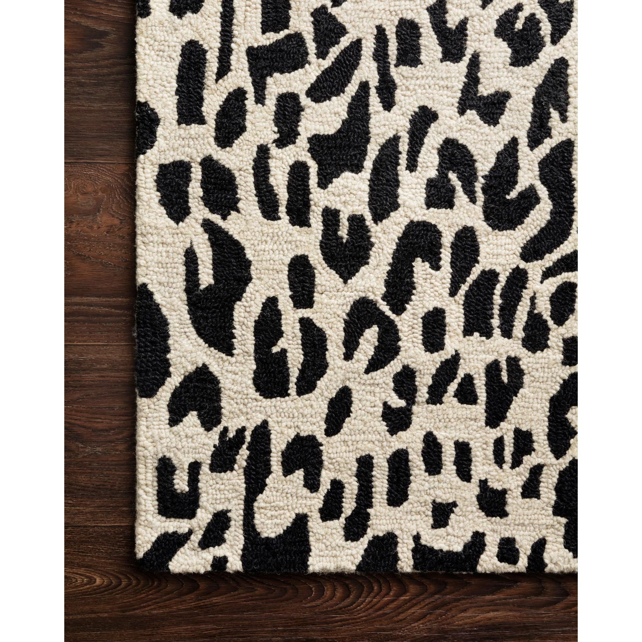 Featuring Masai Black/Ivory Rug by Loloi at Amethyst Home. Hooked of 100% wool, this Masai Collection is a softer side of the savannah brought to life by artisans in India. Masai is a beautiful contemporary rug with contrasting hues and is a chic twist on the classic animal print.
Hooked100% WoolMAS-02 Black / Ivory
Clean spills immediately by blotting wit.  Amethyst Home provides interior design, new home construction design consulting, vintage area rugs, and lighting in the Nashville metro area.