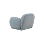 The Hazel lounge chair embraces minimalist, understated elegance with its low-profile, modernist silhouette. Wrapped in exaggerated  velvet fabric, it offers a distinct tactility and comfort. The bold, curved arm design makes a stylish statement, harmonizing with the sleek form to create an inviting focal point in any setting Amethyst Home provides interior design, new home construction design consulting, vintage area rugs, and lighting in the Houston metro area.