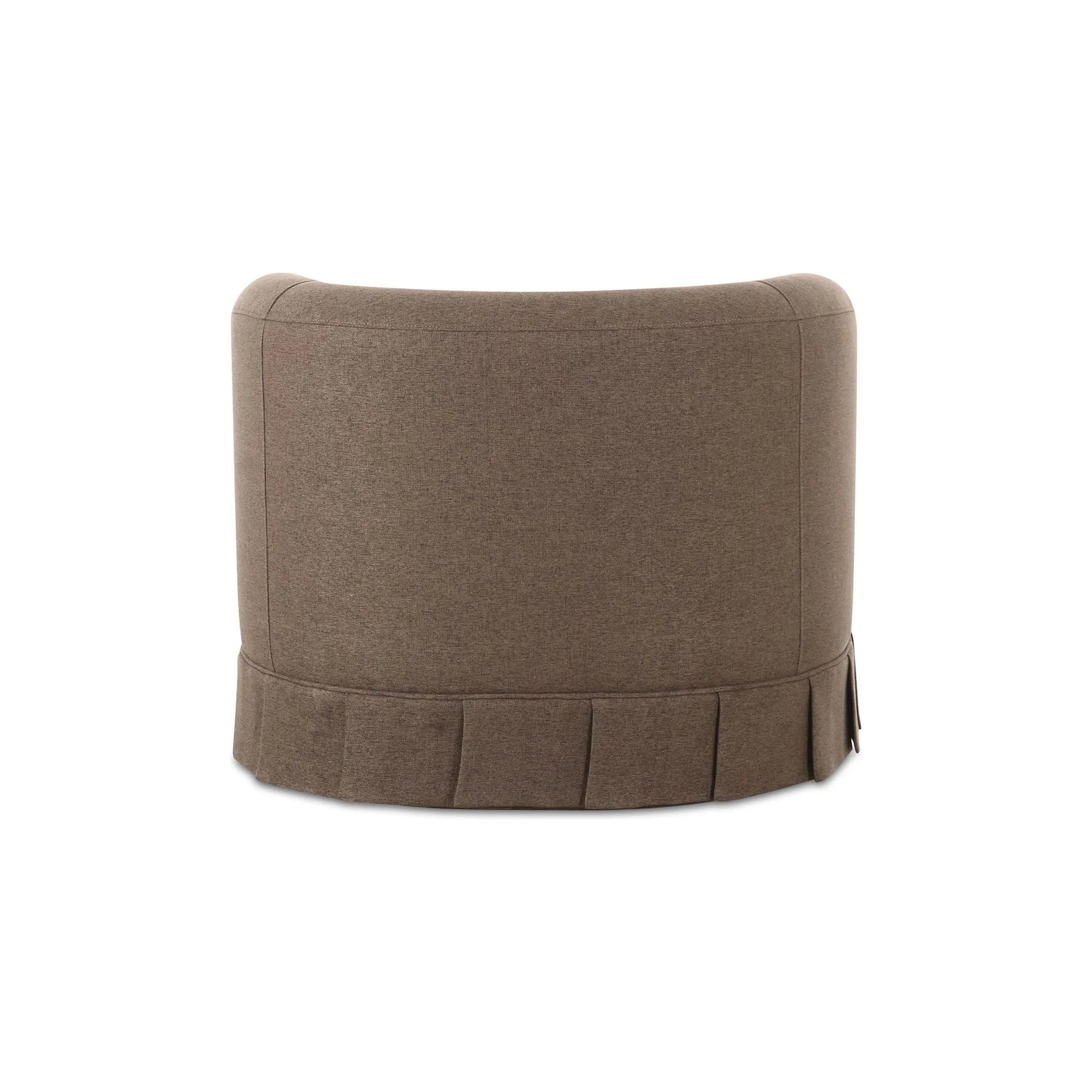 The Maren swivel chair exudes a soft, feminine aesthetic, upholstered in a warm, neutral fabric and featuring a playful yet refined box pleat base reminiscent of vintage finesse, straddling the line between contemporary form and traditional finish. Amethyst Home provides interior design, new home construction design consulting, vintage area rugs, and lighting in the Winter Garden metro area.