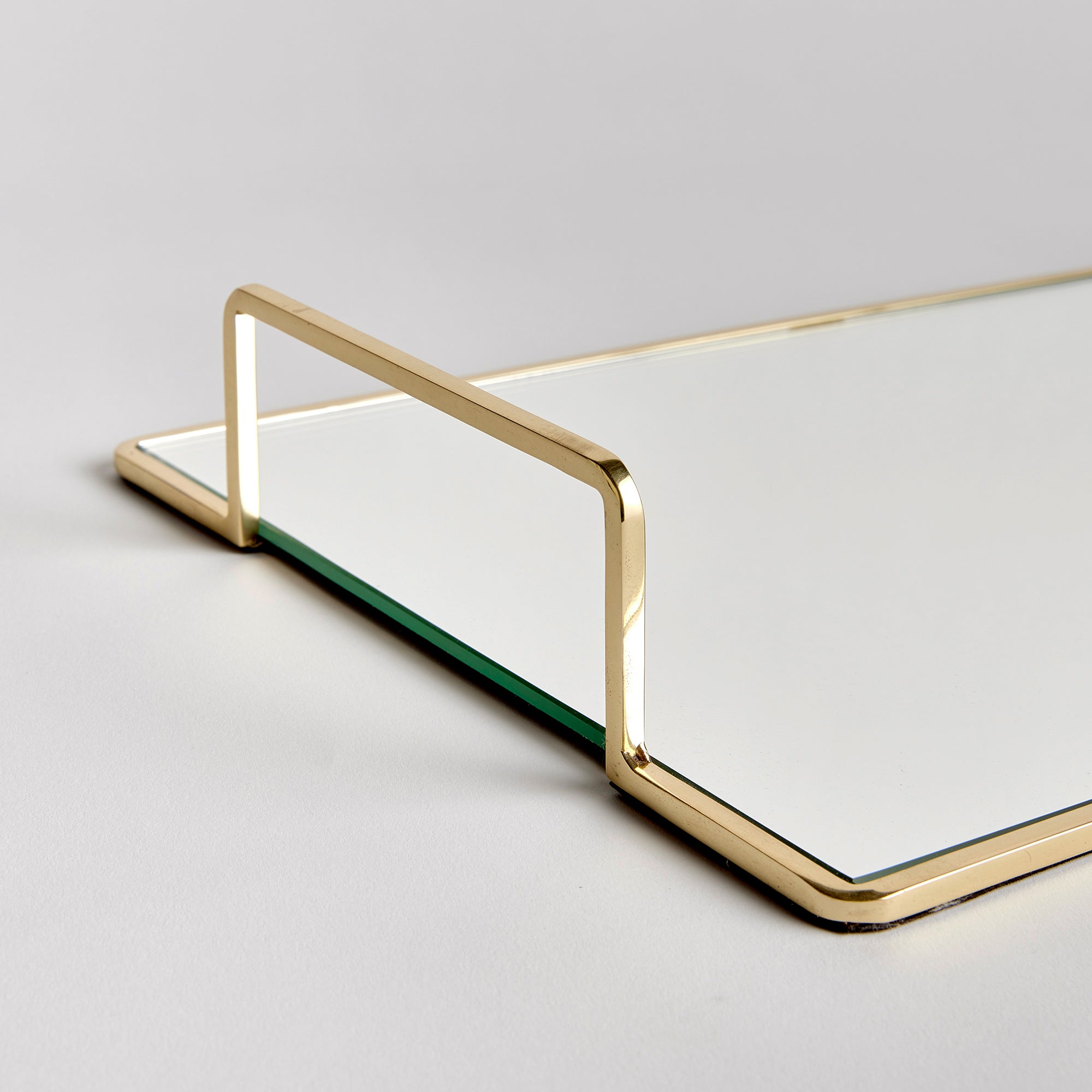 Smooth and streamlined, this mirrored tray is a clean and modern accent. Add to ottoman, side table or even the kitchen counter for a sleek look. Amethyst Home provides interior design, new construction, custom furniture, and area rugs in the Calabasas metro area.