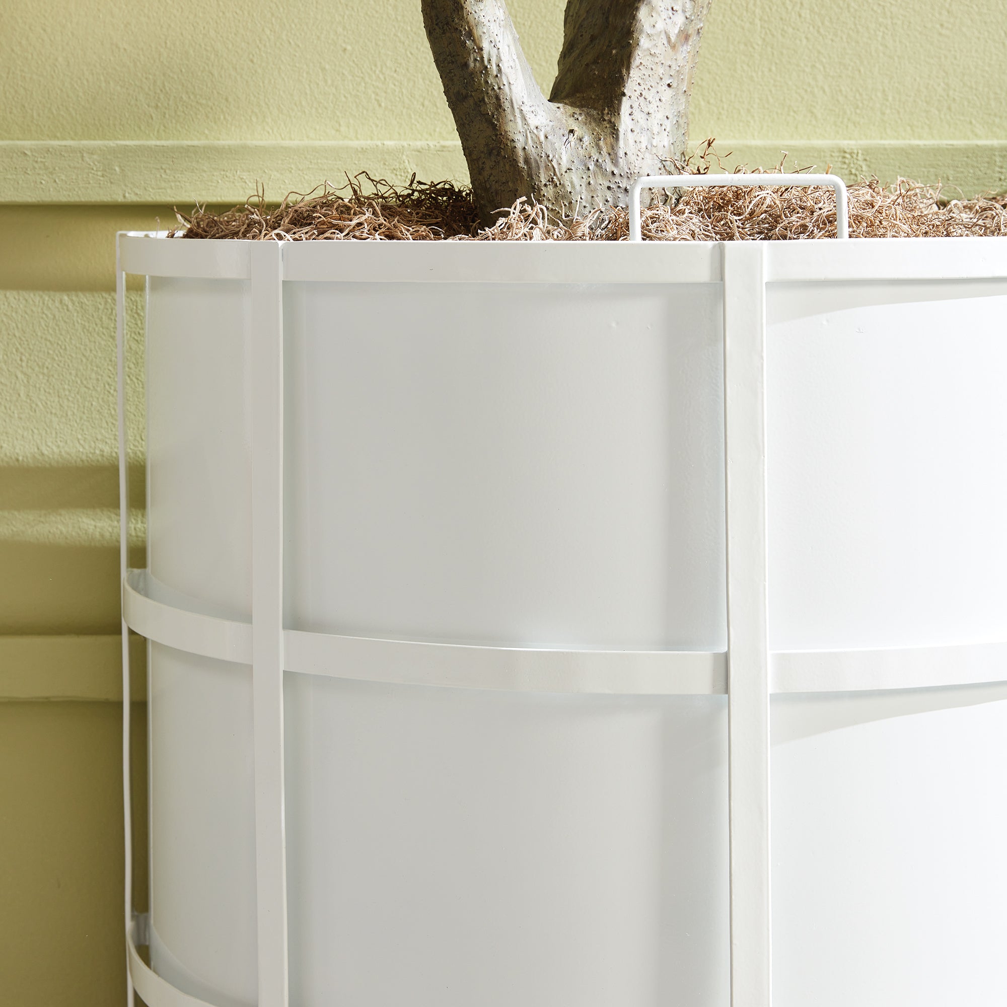 Raised off the ground for proper drainage, this well-scaled demilune planter is the modern interpretation of an antique planter. It is fully powder-coated, and has a removable liner with recessed handles. A statement piece for between windows, garage doors and on patio. Amethyst Home provides interior design, new construction, custom furniture, and area rugs in the Omaha metro area.