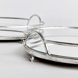 These round mirrored trays are an unexpected combination of antique silver and glass. A classic look with a modern twist. Amethyst Home provides interior design, new construction, custom furniture, and area rugs in the Seattle metro area.