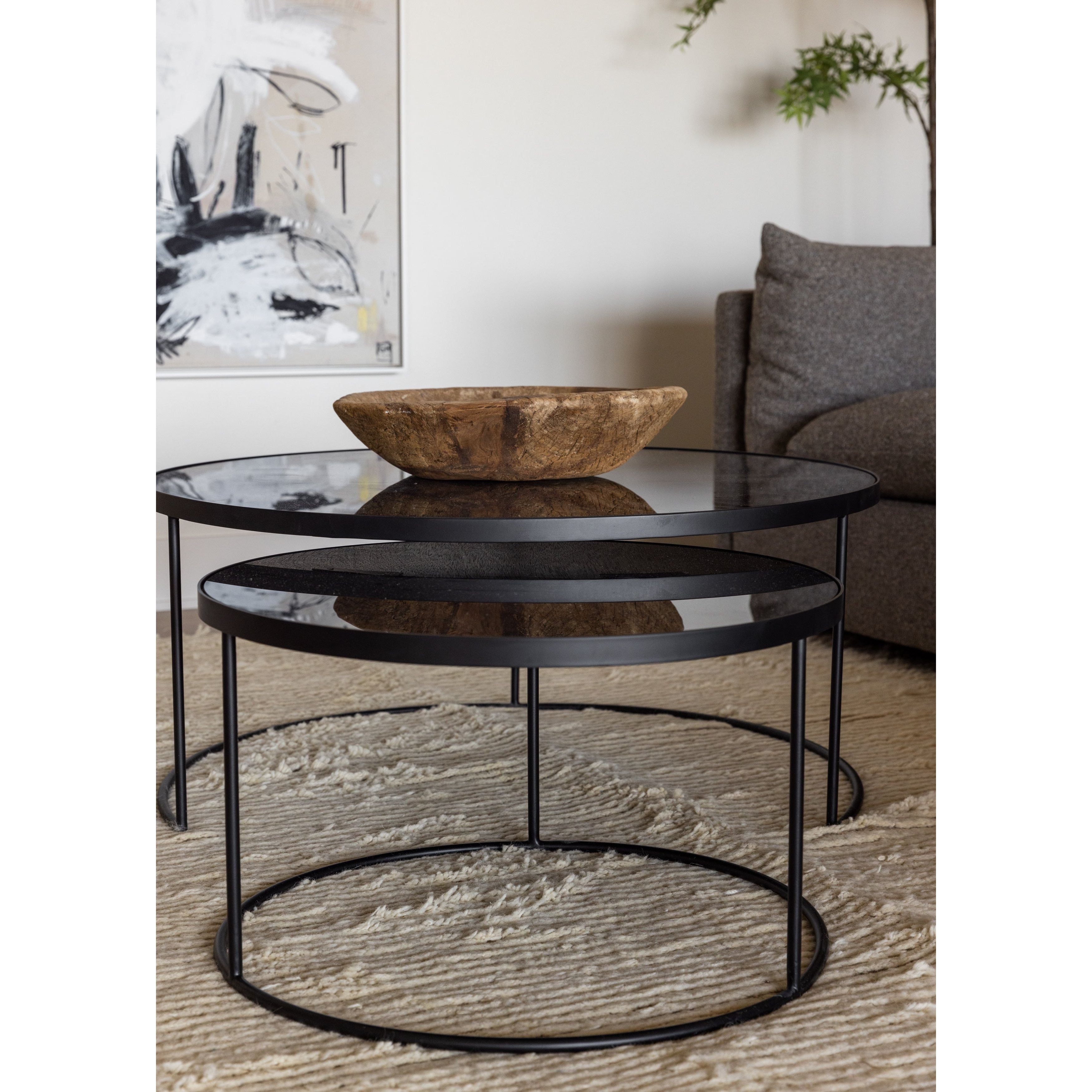 Featuring Nesting Coffee Table Set - Charcoal by Ethnicraft at Amethyst Home. Featuring a heavy aged mirror surface, this Nesting Coffee Table Set - Charcoal brings a vintage look with a modern twist to any living room or lounge area. 
Dimensions: Table 1 - 36.5"w x 36.5"d x 16.5"h Table 2 - 24"w x 24"d x 14"hWeight: 58 lbs
Material: Mirror
For regular dust.  Amethyst Home provides interior design, new home construction design consulting, vintage area rugs, and lighting in the Portland metro area.