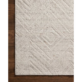 Featuring Raven Ivory / Pebble Rug by Loloi at Amethyst Home. The Raven Ivory / Pebble Rug is intricately handwoven with delicate, fine yarns that amplify the rug's layered and dimensional geometric design. While the rug itself is thick and sturdy, the colors and patterns have a casual lightness that can work in many spaces, from busy living rooms to serene bedrooms. The Raven Ivory. Amethyst Home provides interior design, new construction, custom furniture, and area rugs in the Boston metro area.