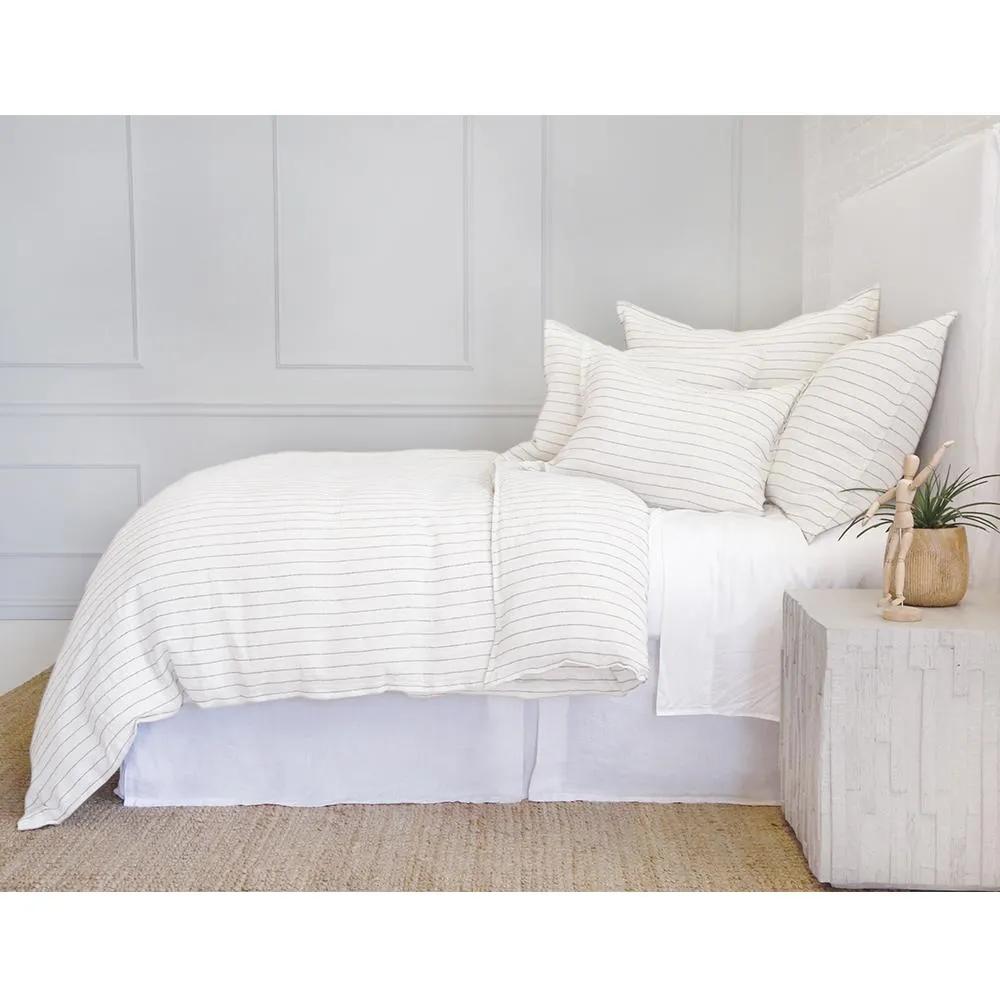 Our Blake Collection features an interwoven stripe texture, giving a modern refresh to a traditional stripe. Our duvet cover and shams are hand-loomed by artisans and the linen is washed for a relaxed lived-in look.The mélange of textures within this woven bedding elevates your space into a sophisticated, yet relaxing retreat. Amethyst Home provides interior design, new home construction design consulting, vintage area rugs, and lighting in the Tampa metro area.