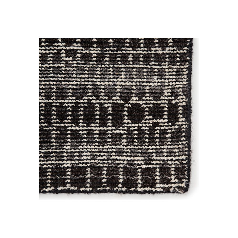 Featuring Reverb Licorice/Espresso Hand-Knotted Rug by Jaipur Living at Amethyst Home. The Reverb collection by Pollack features pattern-rich styles with a globally modern touch. The grid-like geometric design of the hand-knotted Kinetic area rug offers a dynamic look to any space. Crafted of 100% wool, this durable, artisan-made rug is a bold addition to .  Amethyst Home provides interior design, new home construction design consulting, vintage area rugs, and lighting in the Charlotte metro area.