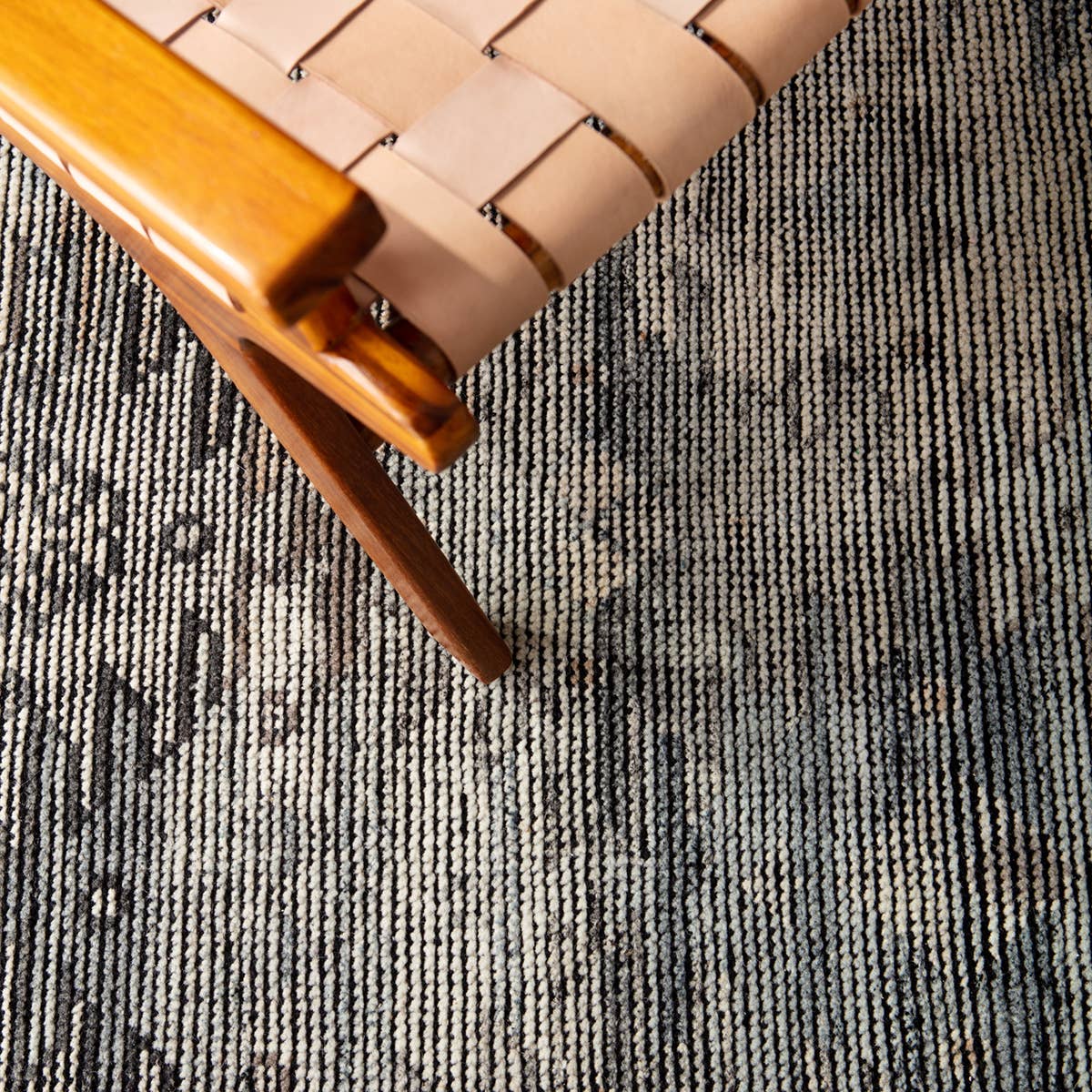 Featuring Rize Nakoda Hand-Knotted Rug by Jaipur Living at Amethyst Home. The Rize Nakoda Area Rug offers intricate and delicately designed global patterns to the modern home. A dynamic tribal motif creates an all-over design on the artistically distressed Nakoda area rug. In a black, tan, white, and blue colorway, this durable hand-knotted wool accent b.  Amethyst Home provides interior design, new home construction design consulting, vintage area rugs, and lighting in the Kansas City metro area.