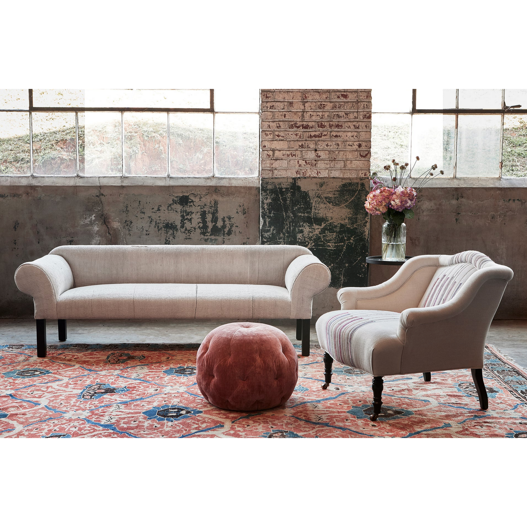 Featuring Pouf 20" Ottoman by Cisco Brothers at Amethyst Home. We love the stitching detail on this Pouf 20" Ottoman by Cisco Brothers. Place in your den, living room, or other entertainment area of your home and keep for years to come! Photographed in Bengal Pin Strip Indigo and Anvil Stone. 
Overall: 20"dia x 15"hSeat Height: 15"h. Amethyst Home provides interior design, new home construction design consulting, vintage area rugs, and lighting in the Nashville metro area.