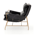 Featuring Taryn Chair - Sonoma Black by Four Hands at Amethyst Home. This Taryn Chair - Sonoma Black is a nod to relaxed modernism, playing up the natural depth of exclusive top-grain leather, with buckle details and low-slung styling crafting the hippest of vibes.
Overall Dimensions: 28"W x 37"L x 35"HColors: Sonoma Black, Aged BrassMaterials: Top Grain Lea.  Amethyst Home provides interior design, new home construction design consulting, vintage area rugs, and lighting in the Houston metro area.