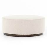 Featuring Sinclair Large Round Ottoman - Knoll Natural by Four Hands at Amethyst Home. This firm round ottoman of textural cream boucle makes a great coffee table or closet bench!
Overall Dimensions: 36"W x 36"L x 14.5"H
Colors: Distressed Natural, Knoll NaturalMaterials: Solid Parawood, 95% Pl, 5% PcFabric: PerformanceWeight: 26.46 lbVolume: 14.02 cu ft.  Amethyst Home provides interior design, new home construction design consulting, vintage area rugs, and lighting in the Dallas metro area.