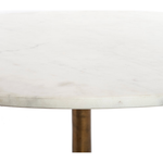 Featuring Helen Round Coffee Table by Four Hands at Amethyst Home. Simple, sophisticated style. The Helen Round Coffee Table has a slim tripod base of raw brass supports a rounded tabletop of polished white marble. Petite scale perfect for smaller spaces or rooms with a sectional.
Overall Dimensions: 32"W x 32"L x 16.50"H
Colors: Raw Brass, Polished White.  Amethyst Home provides interior design, new home construction design consulting, vintage area rugs, and lighting in the San Diego metro area.