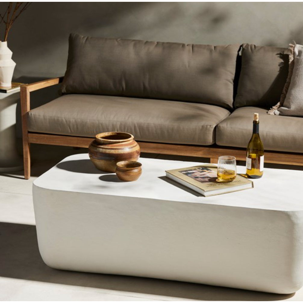 Featuring Basil Large Outdoor Rectangle Coffee Table by Four Hands at Amethyst Home. With organic curved edges and a hollow metal profile, this Basil coffee table is an Amethyst favorite.  Easy to wipe and we love how the modern look pops against your favorite seasonal flowers.
Overall Dimensions: 50"W x 25"L x 16"HColors: Matte White Cast AluminumMaterials: . Amethyst Home provides interior design, new home construction design consulting, vintage area rugs, and lighting in the Houston metro area.