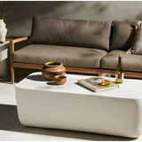 Featuring Basil Large Outdoor Rectangle Coffee Table by Four Hands at Amethyst Home. With organic curved edges and a hollow metal profile, this Basil coffee table is an Amethyst favorite.  Easy to wipe and we love how the modern look pops against your favorite seasonal flowers.
Overall Dimensions: 50"W x 25"L x 16"HColors: Matte White Cast AluminumMaterials: . Amethyst Home provides interior design, new home construction design consulting, vintage area rugs, and lighting in the Houston metro area.