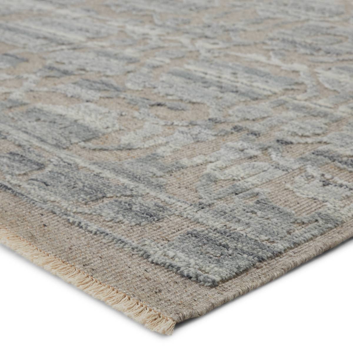 Featuring Sonnette Pearson Hand-Knotted Rug by Jaipur Living at Amethyst Home. The richly textured and elegantly designed Sonnette Pearson Area Rug combines an inviting, soft hand and eye-catching transitional style. The Sonnette area rug has a subtle design with gorgeous tonal grays and taupes. This hand-knotted wool rug features fringe trimmed details .  Amethyst Home provides interior design, new home construction design consulting, vintage area rugs, and lighting in the Los Angeles metro area.
