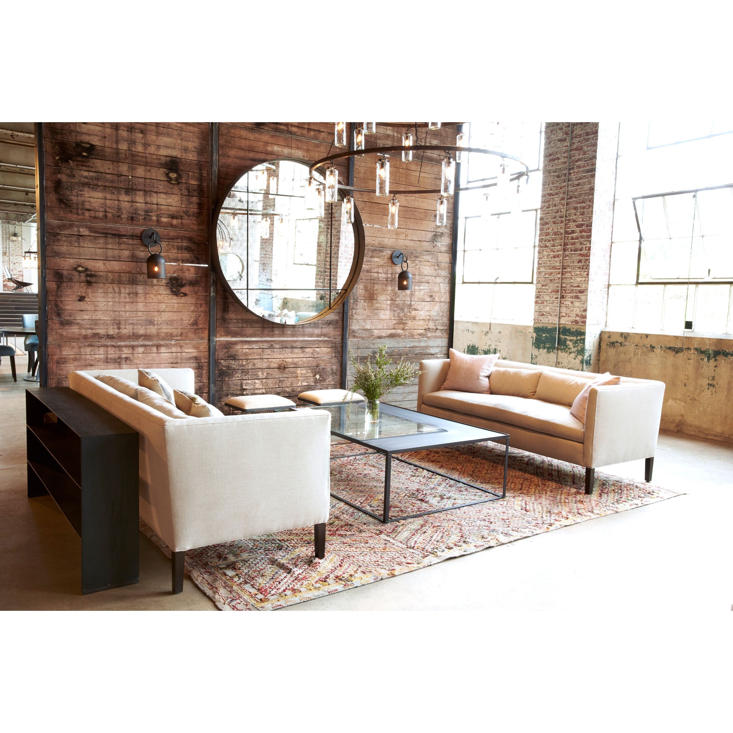 Featuring Stewart Sofa by Cisco Brothers at Amethyst Home. The Stewart Sofa by Cisco Brothers has a simple silhouette with striking angles and trim wooden accent legs. The wide bench cushion provides ample seating space ideal for entertaining. Pop some popcorn and pile on the throw pillows for cozy movie nights with the family. Photographed in Vintage Flax. . Amethyst Home provides interior design, new home construction design consulting, vintage area rugs, and lighting in the Houston metro area.