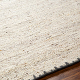 Featuring Berkeley Natural / Charcoal Rug by Surya at Amethyst Home. Pleasantly soft to the touch, this organic flecked wool rug is perfect for a minimalist look.  The unique stitching is our favorite part!  Simply vacuum regularly and clean spills with soap and water.
Hand WovenWoolBKY-2300. Amethyst Home provides interior design, new construction, custom furniture, and rugs for Austin metro area