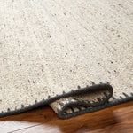 Featuring Berkeley Natural / Charcoal Rug by Surya at Amethyst Home. Pleasantly soft to the touch, this organic flecked wool rug is perfect for a minimalist look.  The unique stitching is our favorite part!  Simply vacuum regularly and clean spills with soap and water.
Hand WovenWoolBKY-2300. Amethyst Home provides interior design, new construction, custom furniture, and rugs for Nashville metro area
