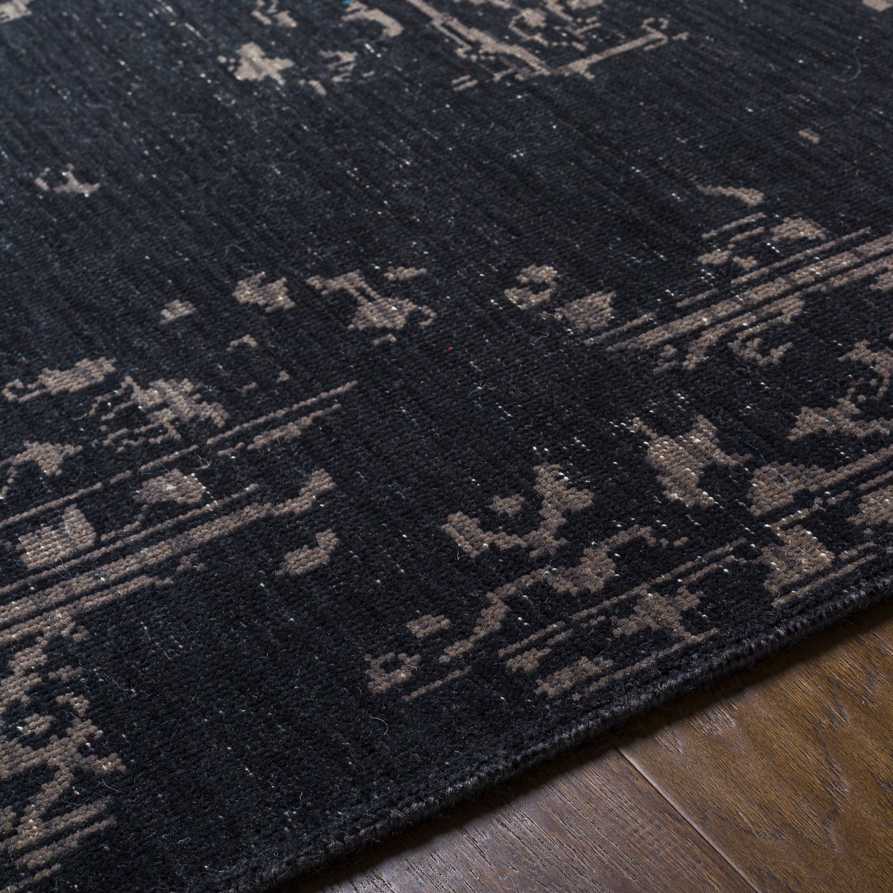 Featuring Festival Dark Charcoal Hand-Knotted Rug by Surya at Amethyst Home. The Festival Collection showcases traditional inspired designs that exemplify timeless styles of elegance, comfort, and sophistication. With their hand knotted construction, these rugs provide a durability that can not be found in other handmade constructions, and boasts the abili.  Amethyst Home provides interior design, new home construction design consulting, vintage area rugs, and lighting in the Nashville metro area.