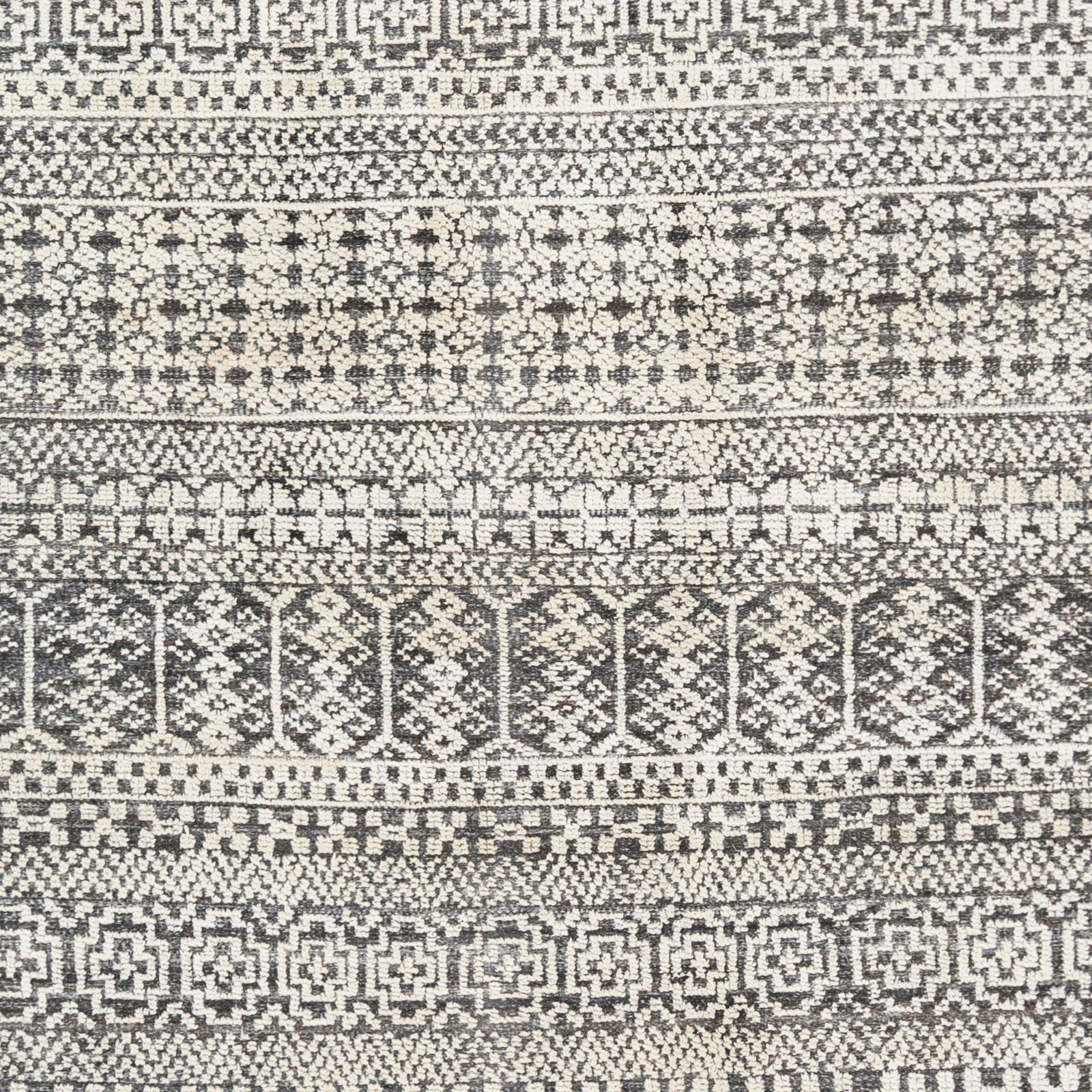 Featuring Nobility Charcoal Hand-Knotted Rug by Surya at Amethyst Home. Add an elegant touch to any space with this hand-knotted Nobility Charcoal Rug. Its blend of wool and viscose is ultra soft and smooth, while its timeless ornate motif with modern lines create an exquisite, timeless piece. Enjoy its high-low characteristics and luxurious feel to add a touch of sophistication to y. Amethyst Home provides interior design, new construction, custom furniture, and area rugs in the Omaha metro area.