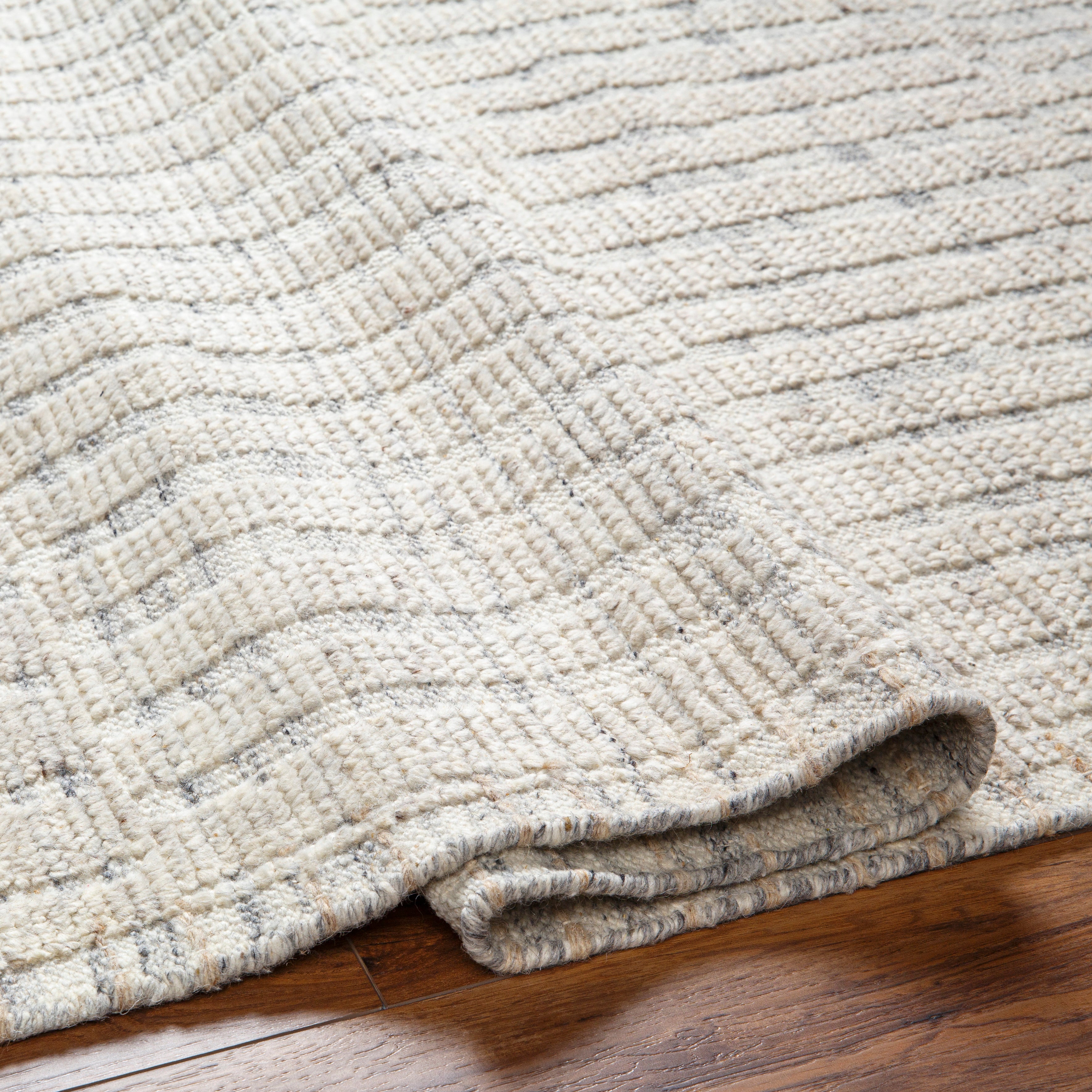 Featuring Tunus Ethan Hand-Knotted Rug by Surya at Amethyst Home. The simplistic yet compelling rugs from the Tunus Collection effortlessly serve as the exemplar representation of modern decor. With their Hand-Knotted construction, these rugs provide a durability that can not be found in other handmade constructions, and boasts the ability to be thoroughly cleaned as it contains no c. Amethyst Home provides interior design, new construction, custom furniture, and area rugs in the Boston metro area